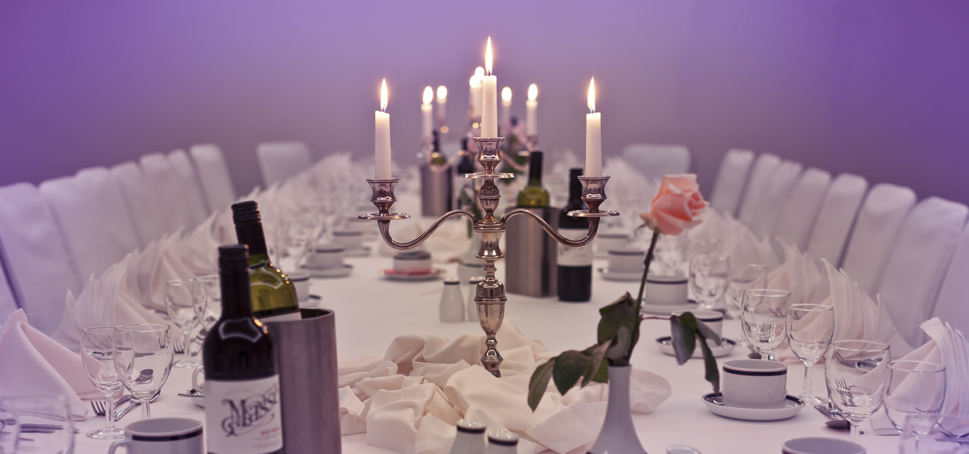 Portland Suite dining table with candles, ideal for weddings and corporate events.