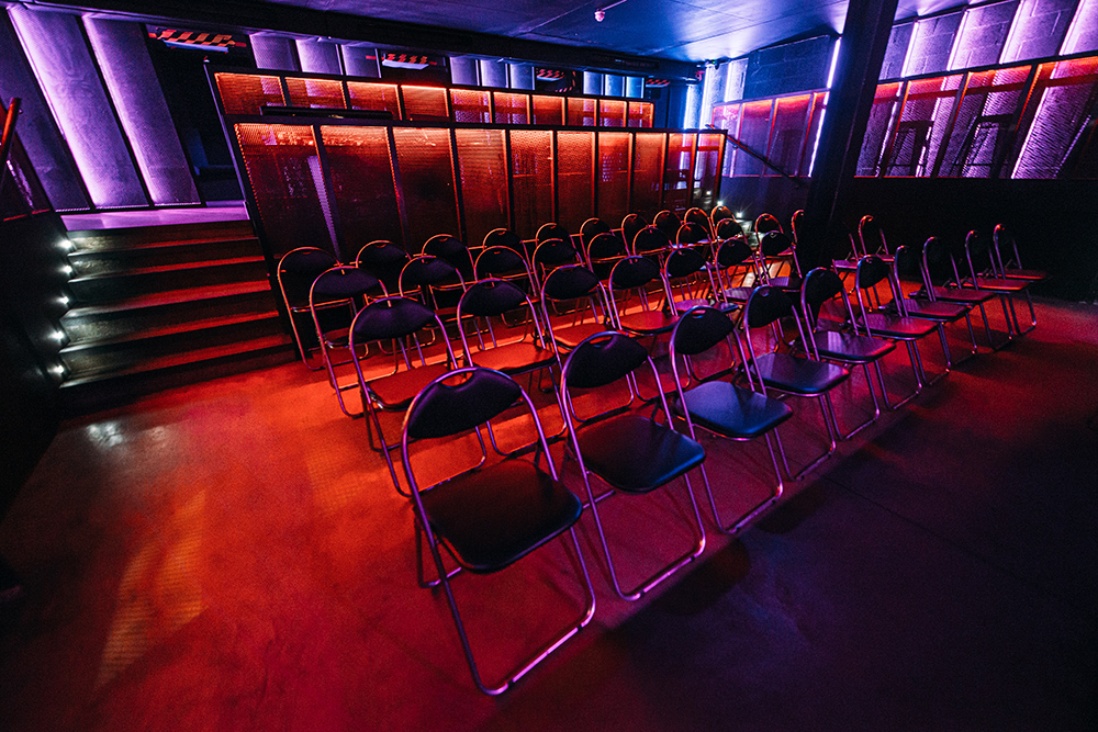 Modern event space with metallic chairs for presentations in Peckham Audio.