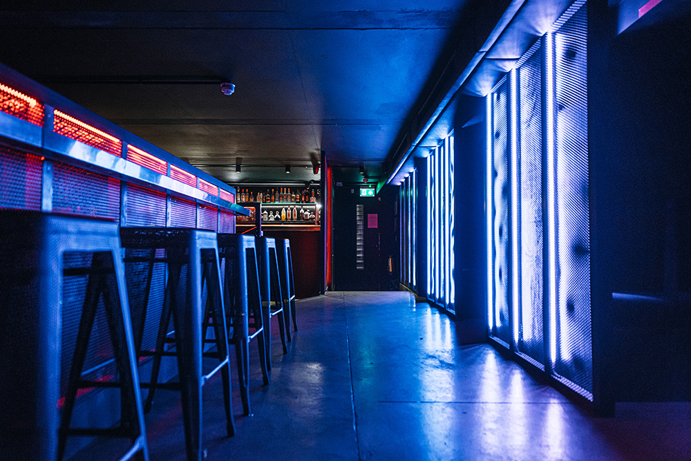 Modern venue with neon lights, ideal for networking events in Peckham.