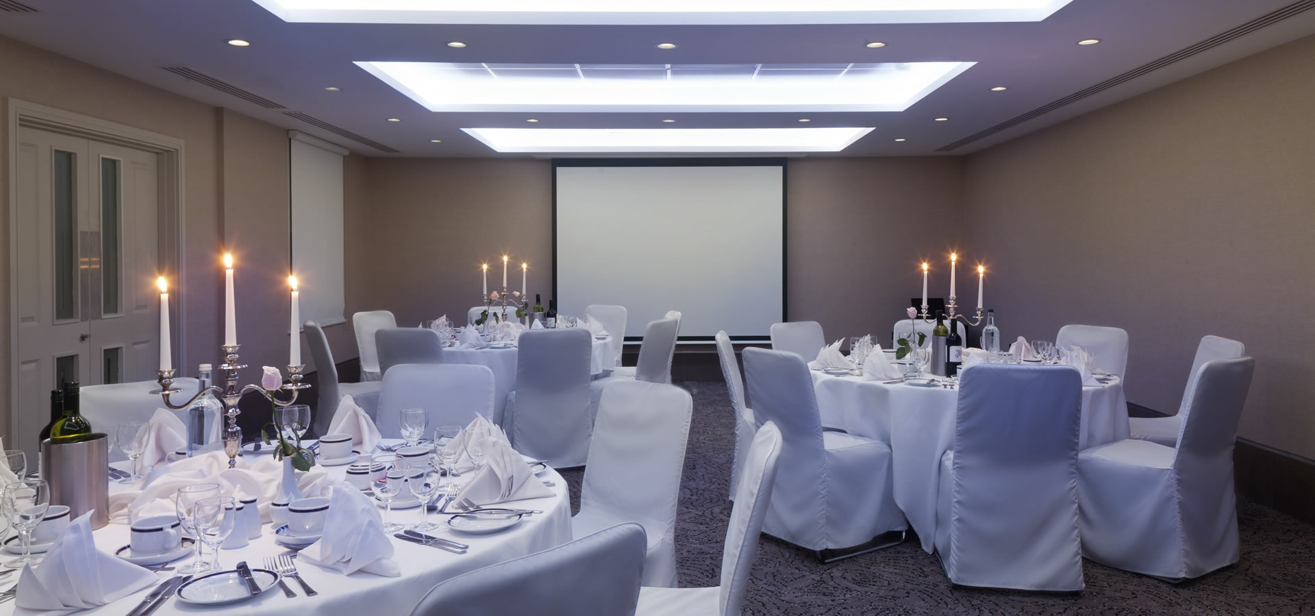 Langham Suite at Langham Court Hotel, elegant dinner setup for corporate events.