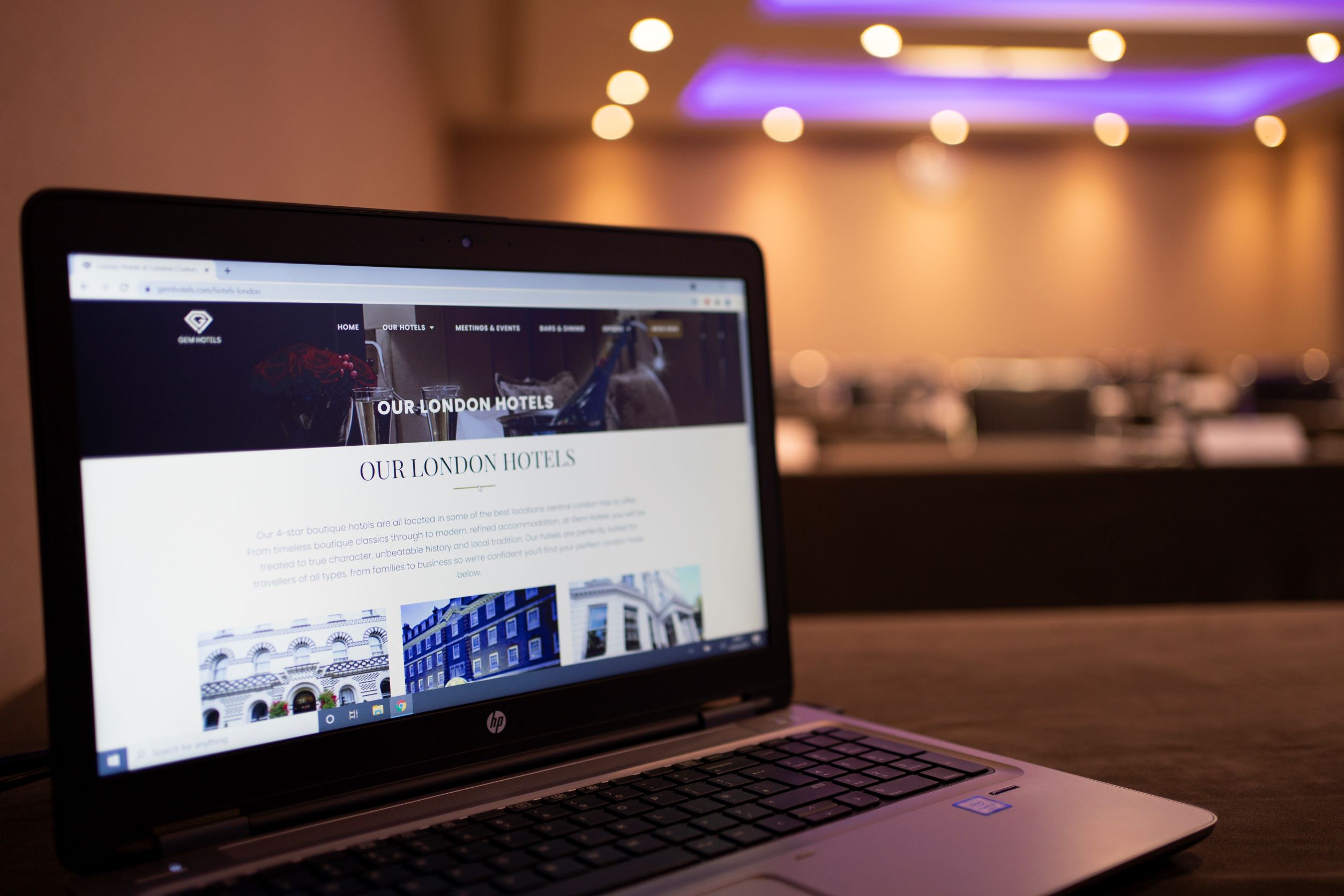 Langham Suite meeting room with laptop, perfect for corporate events and conferences.