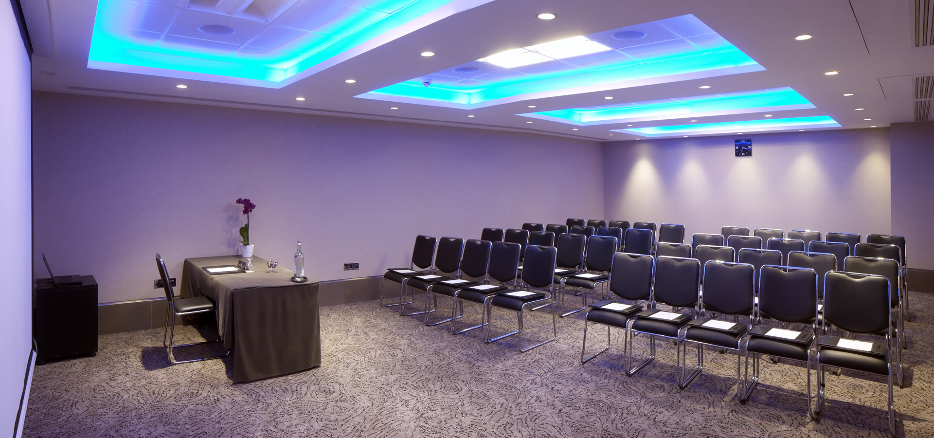 Langham Suite meeting room with long table, ideal for corporate events and seminars.