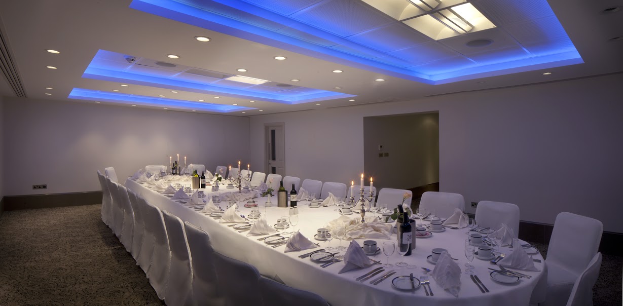 Langham Suite at Langham Court Hotel, elegant dinner setup with fine china and soft lighting.