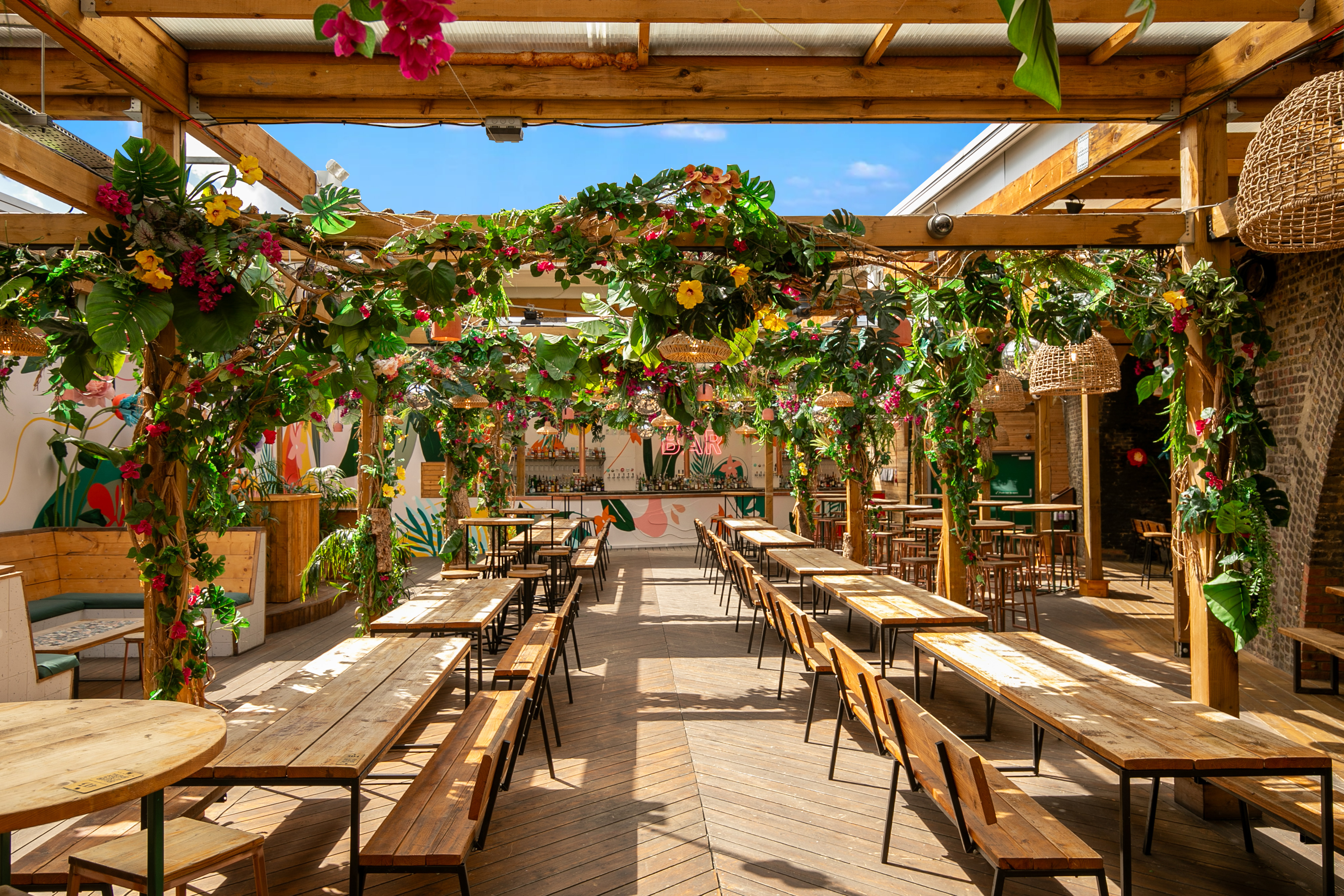 Vibrant outdoor event space at Pergola Brixton with lush greenery for gatherings.