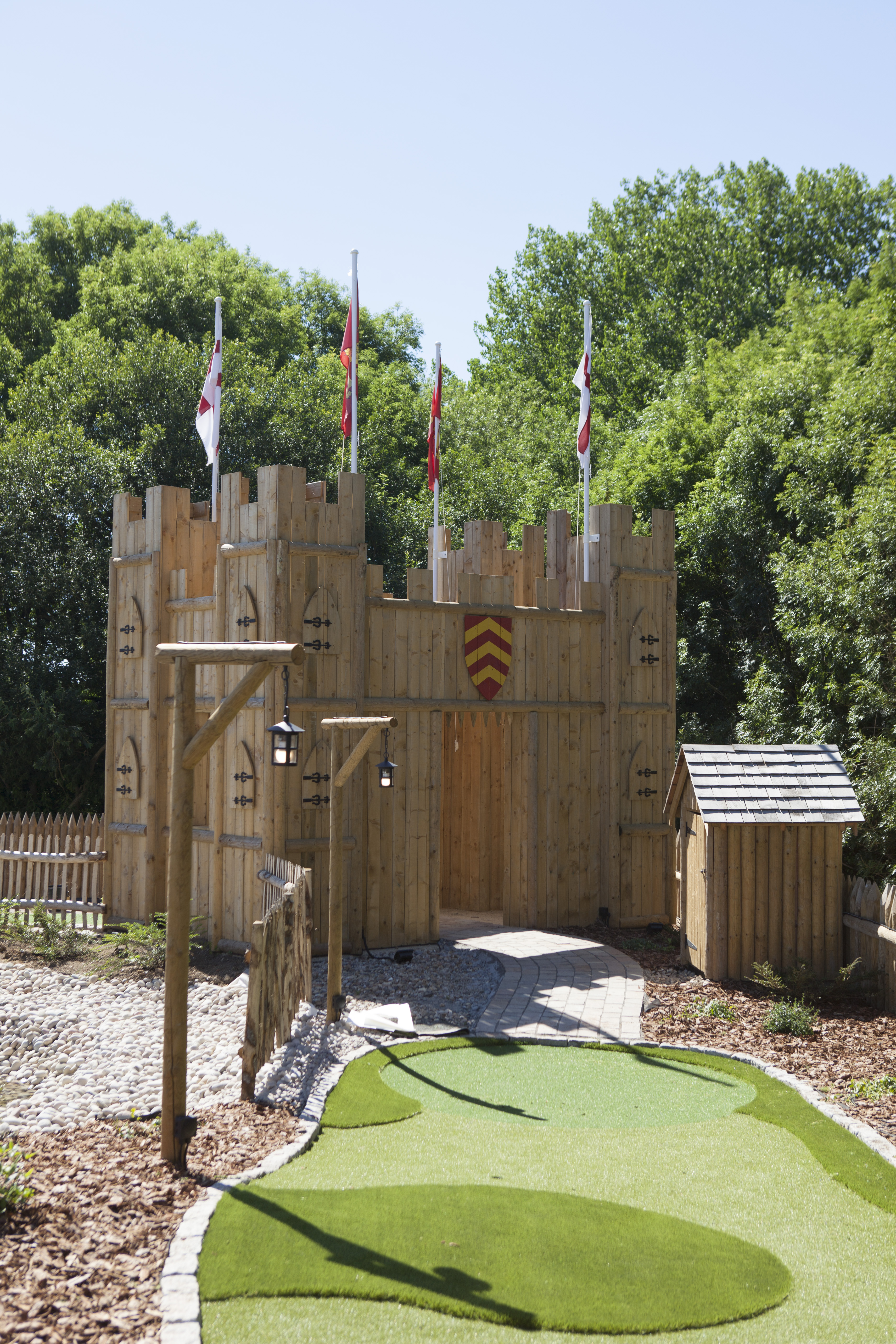 Rustic wooden castle at Adventure Golf Course, perfect for themed events and gatherings.