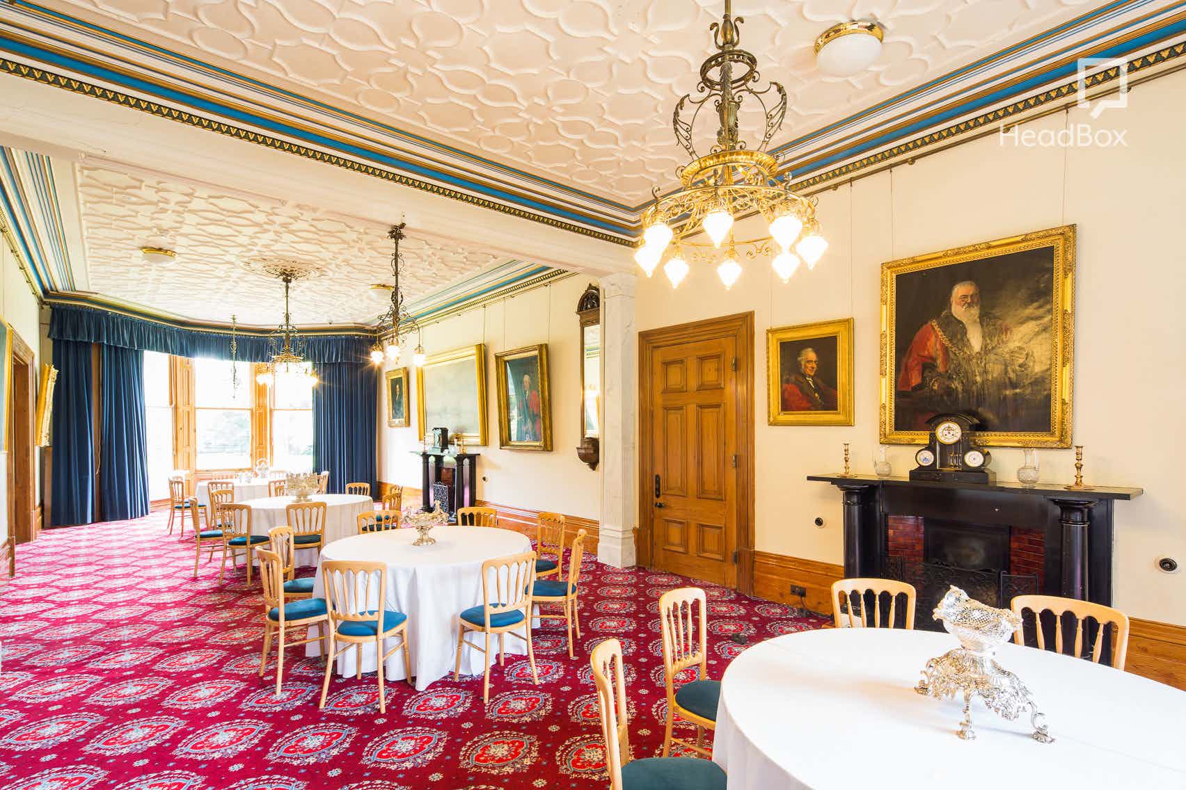 Elegant event space in The Mansion House with chandeliers, perfect for receptions and meetings.