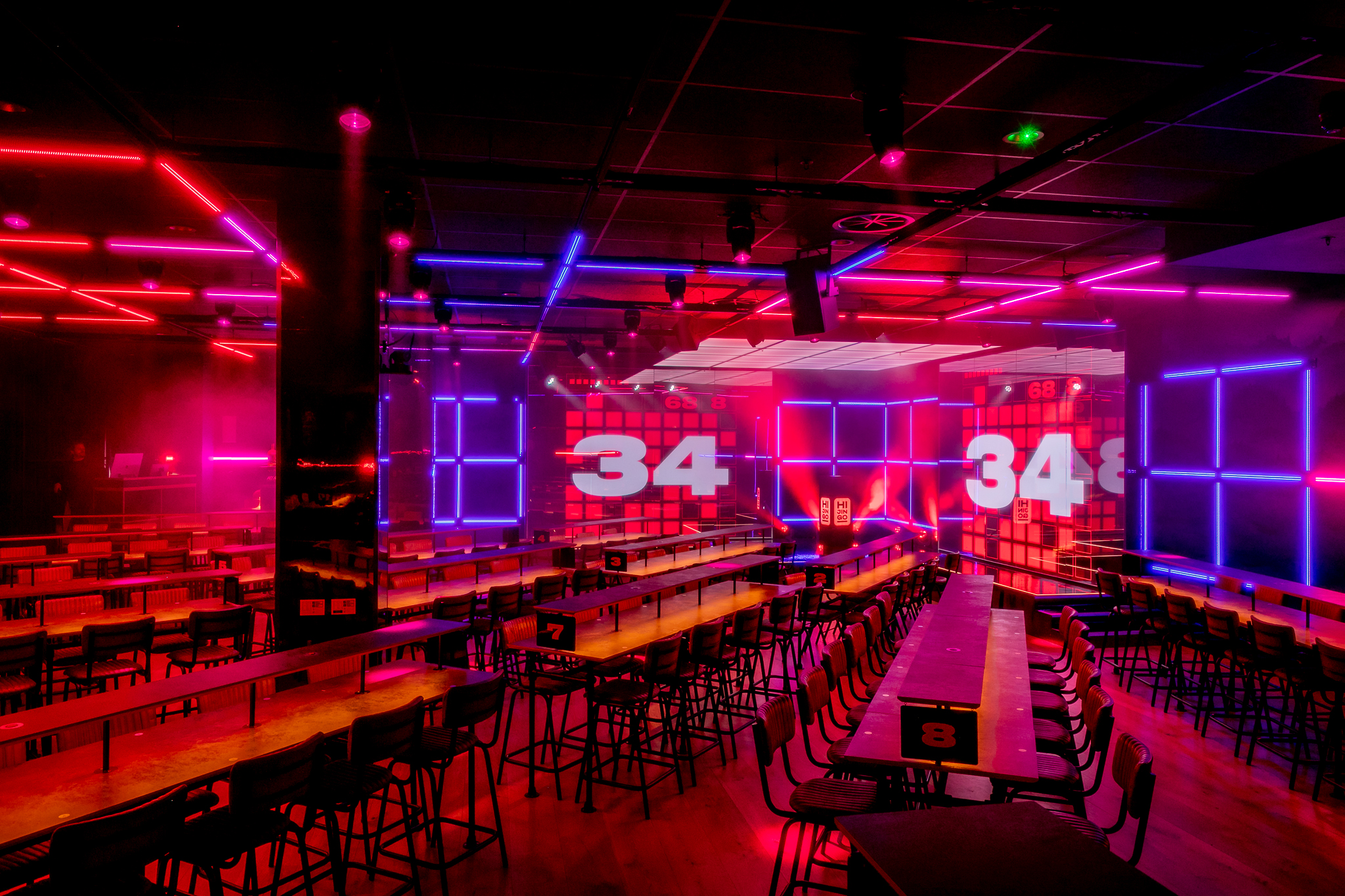 Vibrant event space at Hijingo with neon lighting for conferences and product launches.
