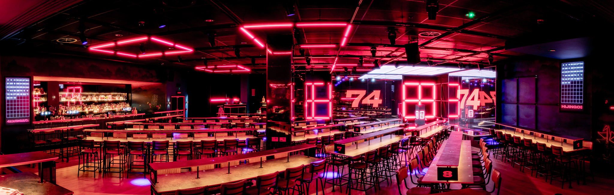 Modern event space in Hijingo with vibrant neon lighting for networking and corporate meetings.