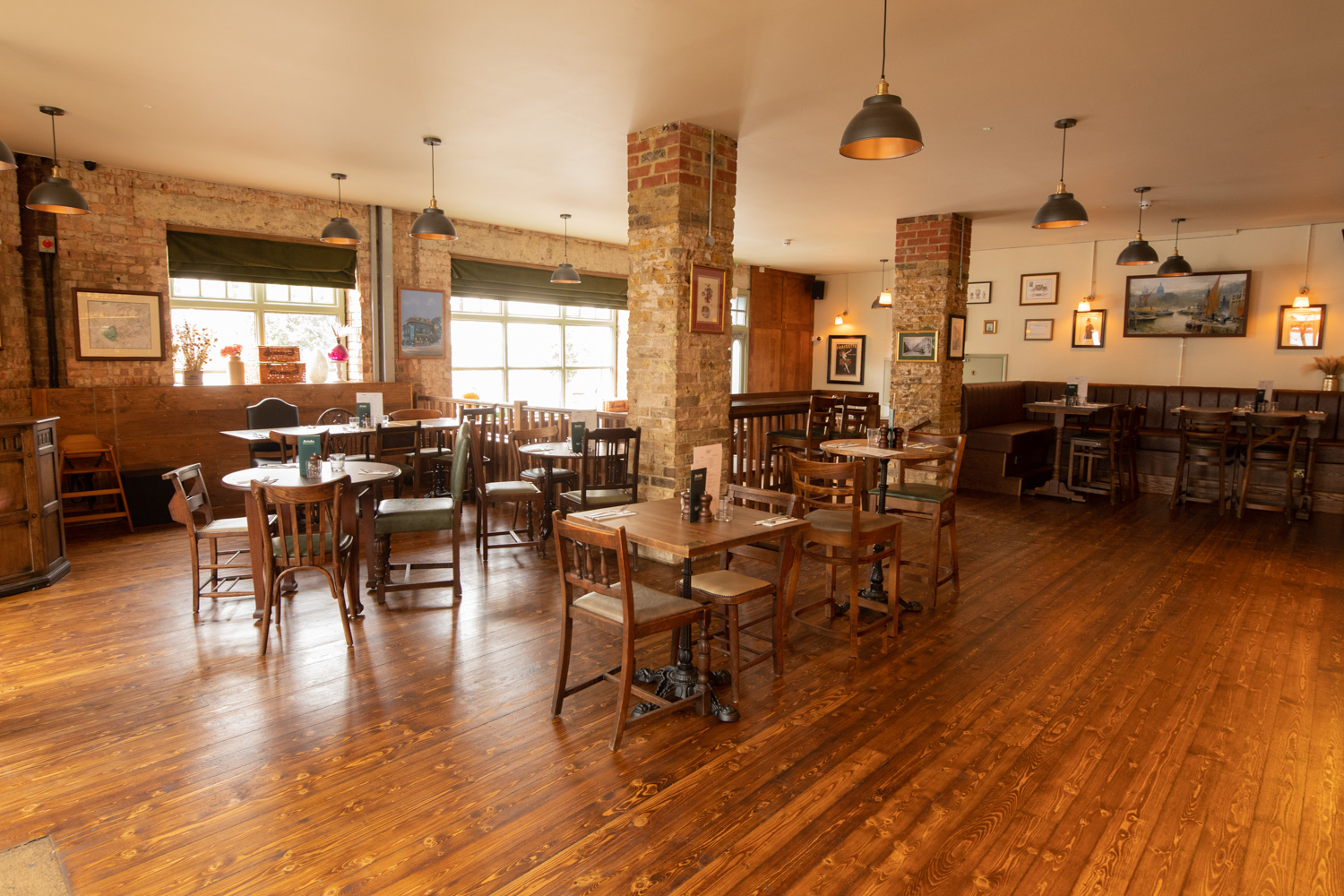Versatile event space with wooden floors, ideal for networking and workshops at The Prince.