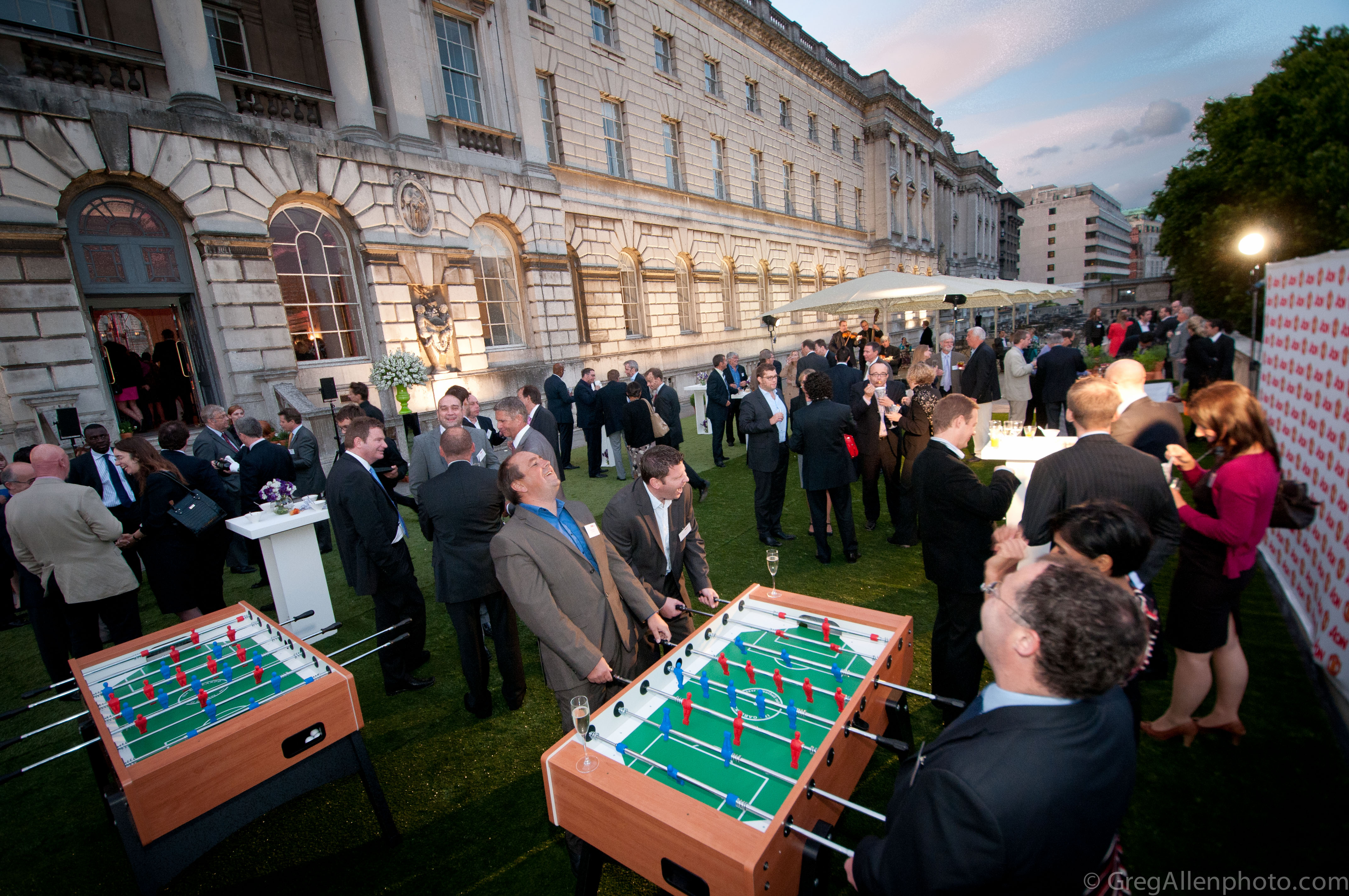 Outdoor networking event at Somerset House with foosball and elegant ambiance.