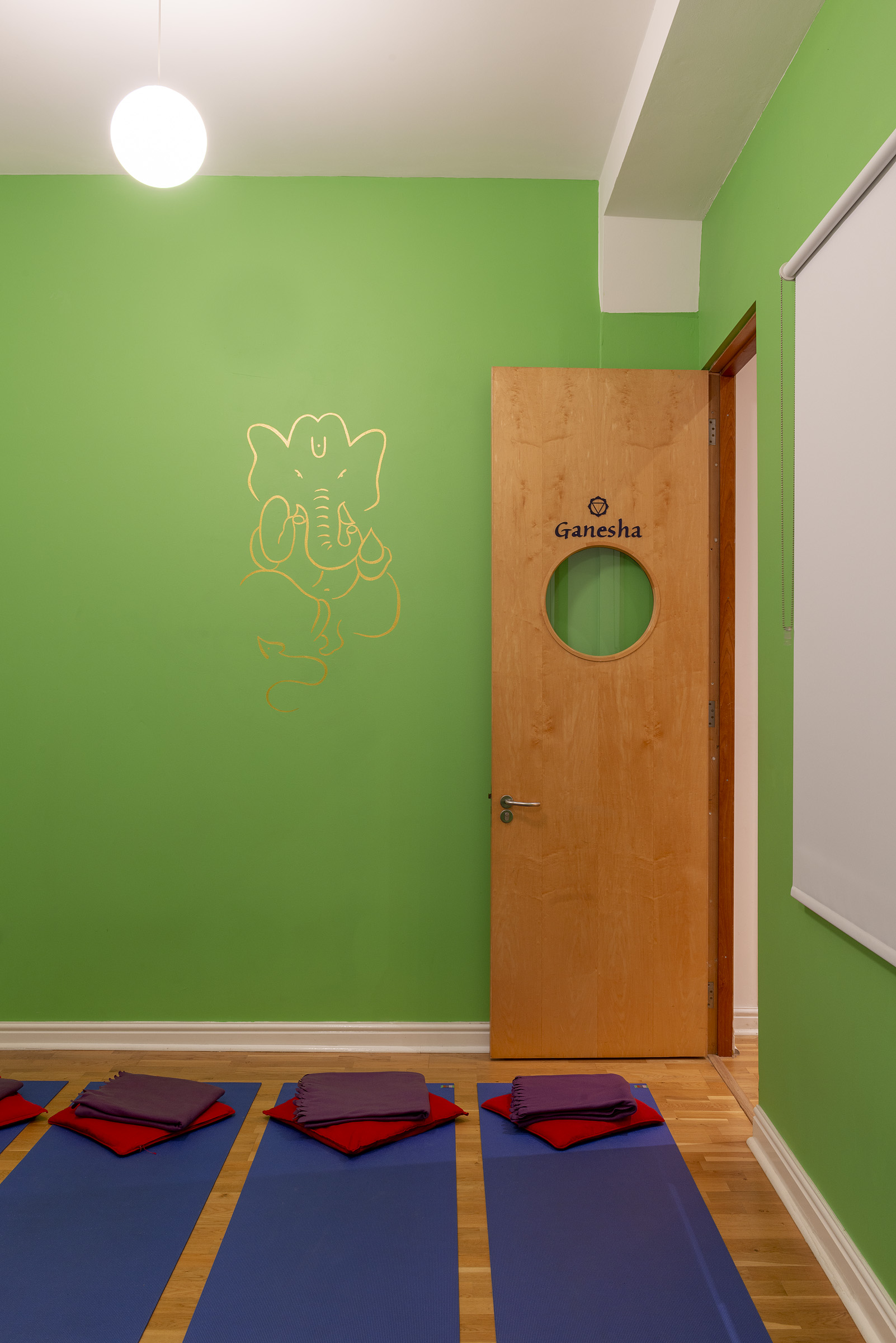 Vibrant Ganesha door at Tara Yoga Centre, perfect for creative meetings and cultural events.