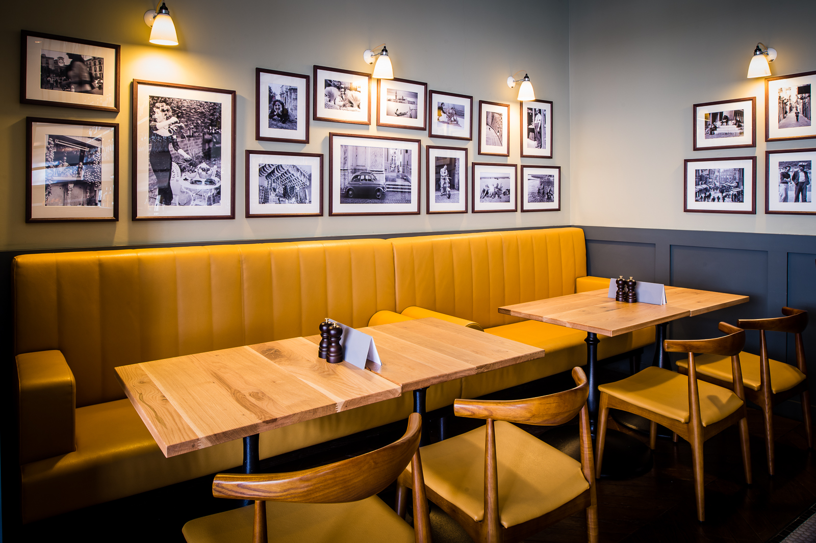 Cozy TOZI Restaurant & Bar with warm yellow seating, ideal for intimate events.