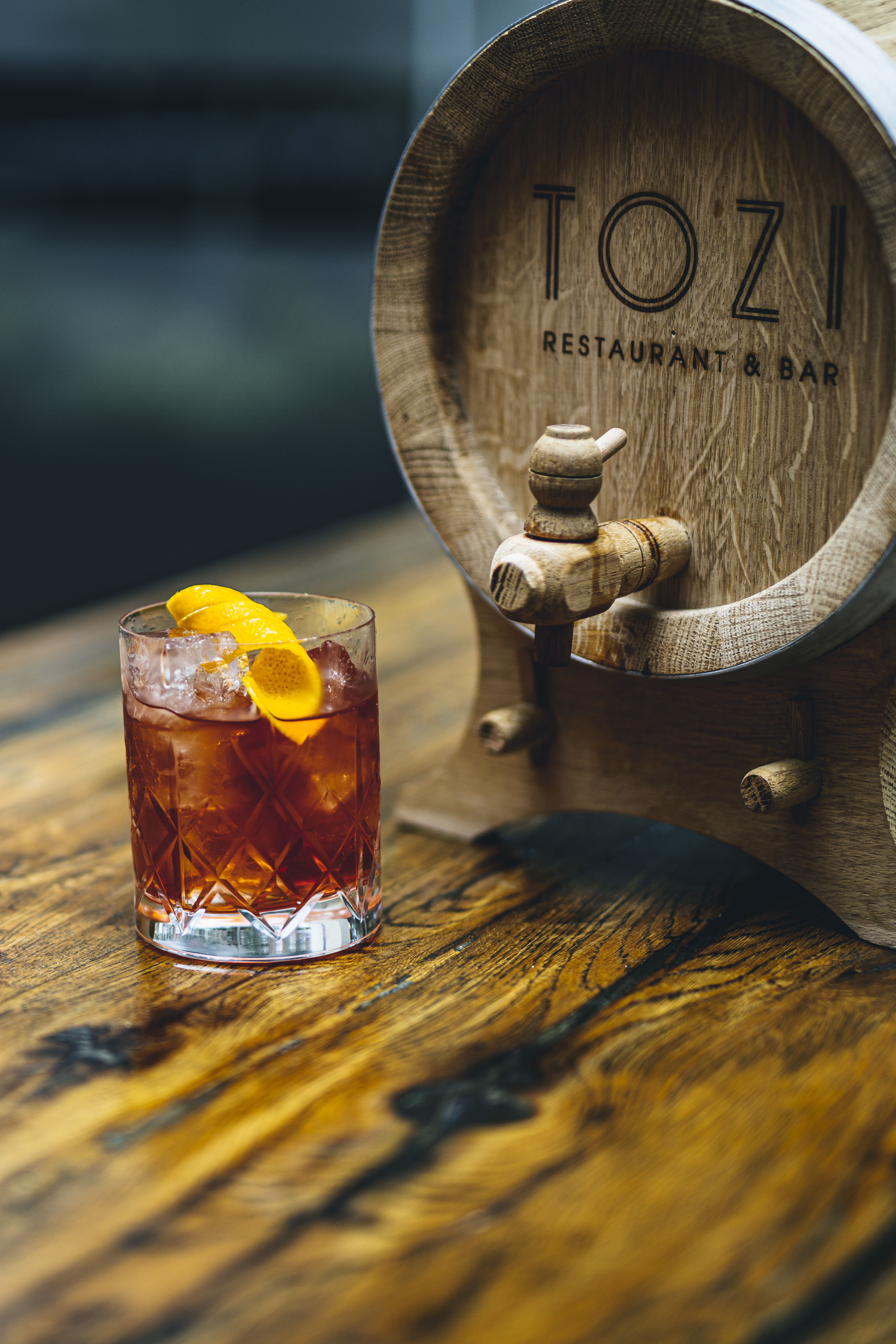 Elegant cocktail in glass at TOZI Restaurant & Bar, perfect for sophisticated events.