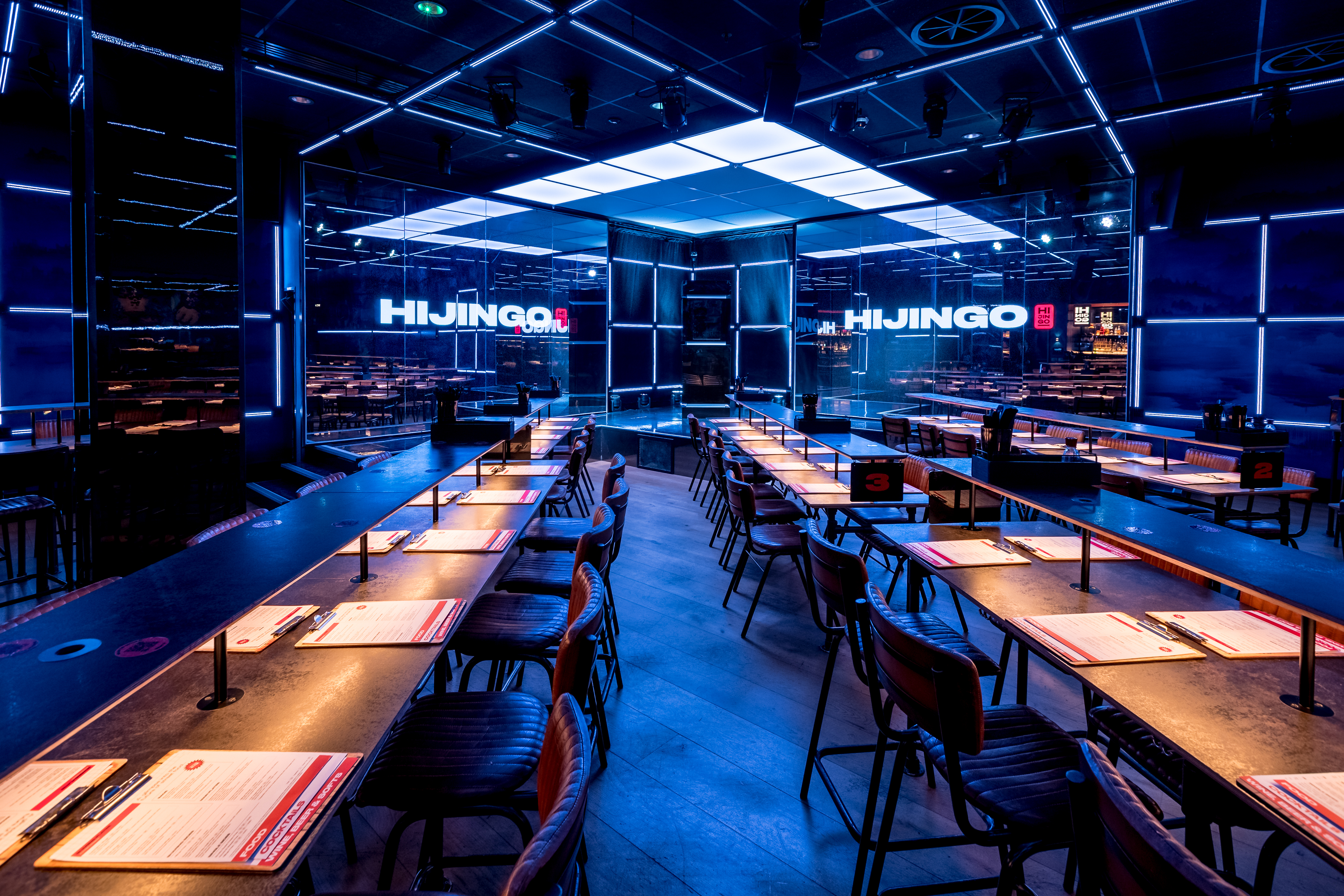 Modern event space at Hijingo with communal table for interactive dining experiences.