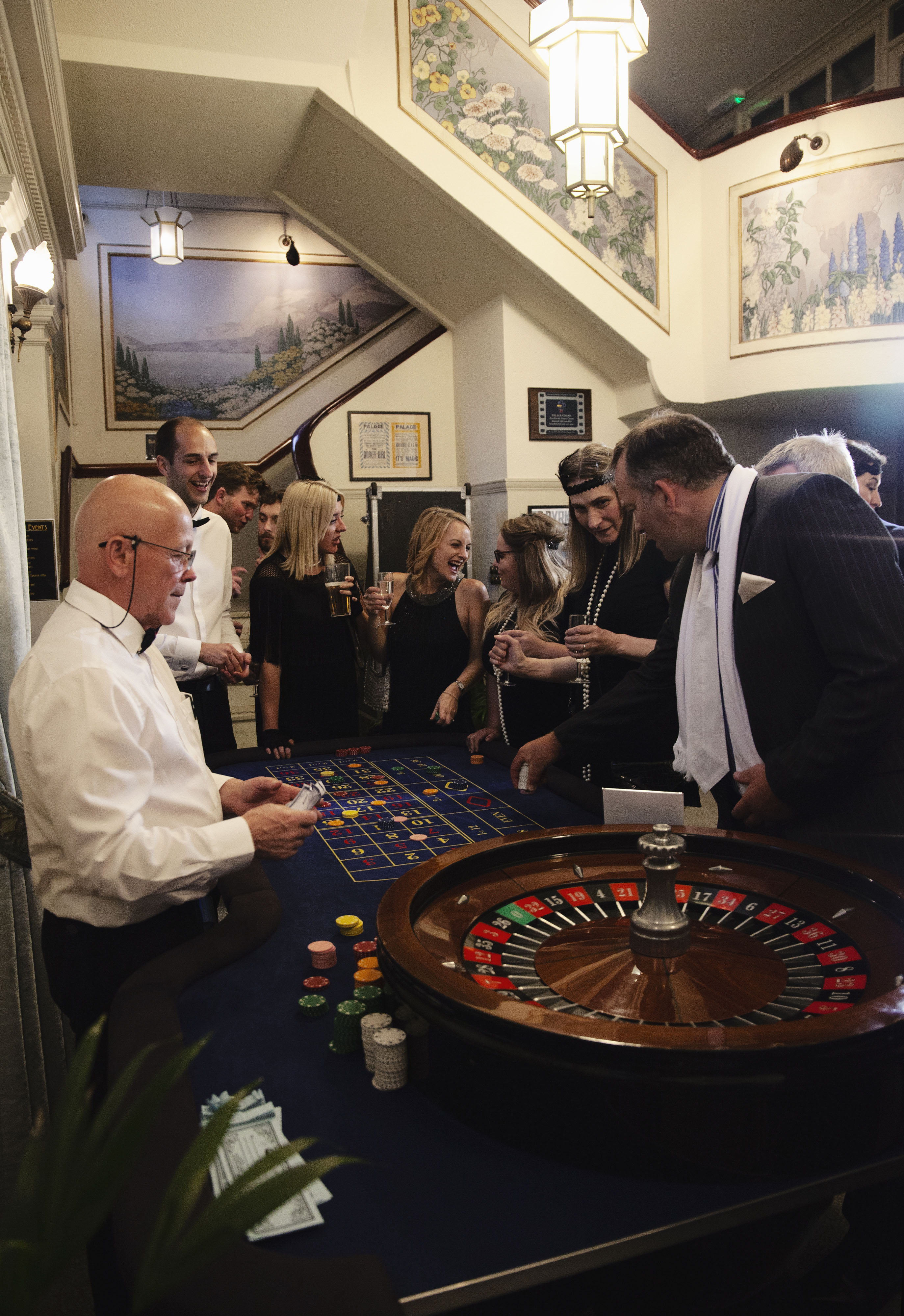 Casino-themed event at Bridport Electric Palace with guests at a roulette table.