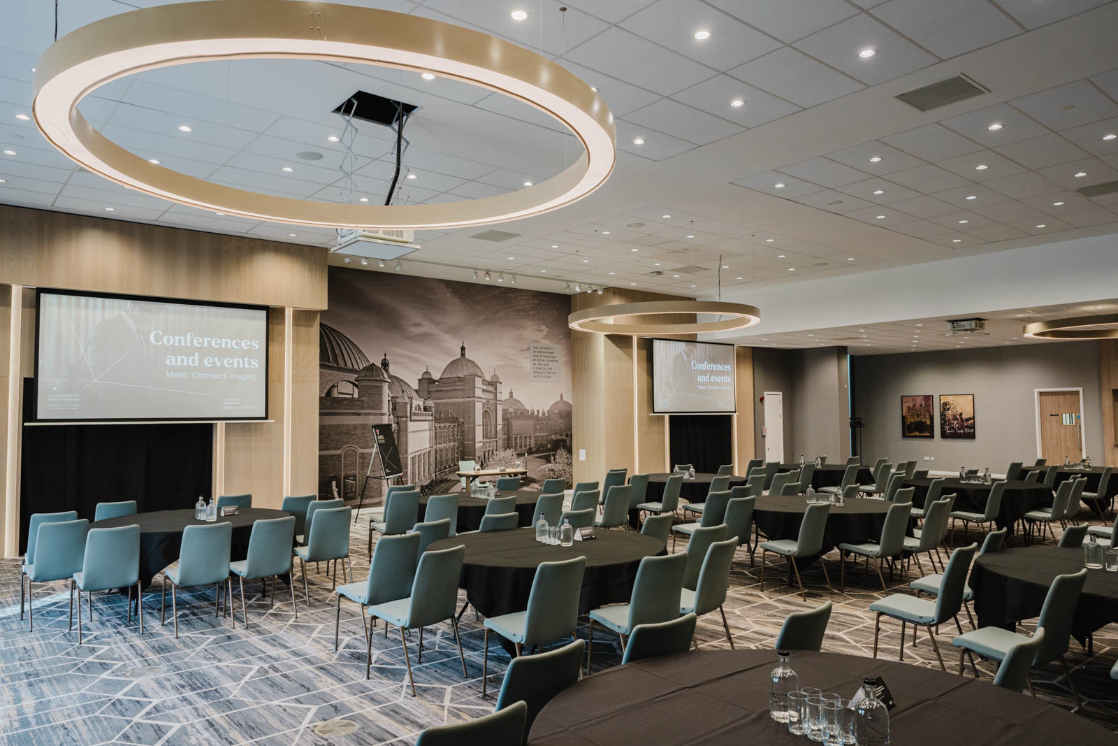 Fry Suite conference room with elegant round tables, ideal for events and presentations.