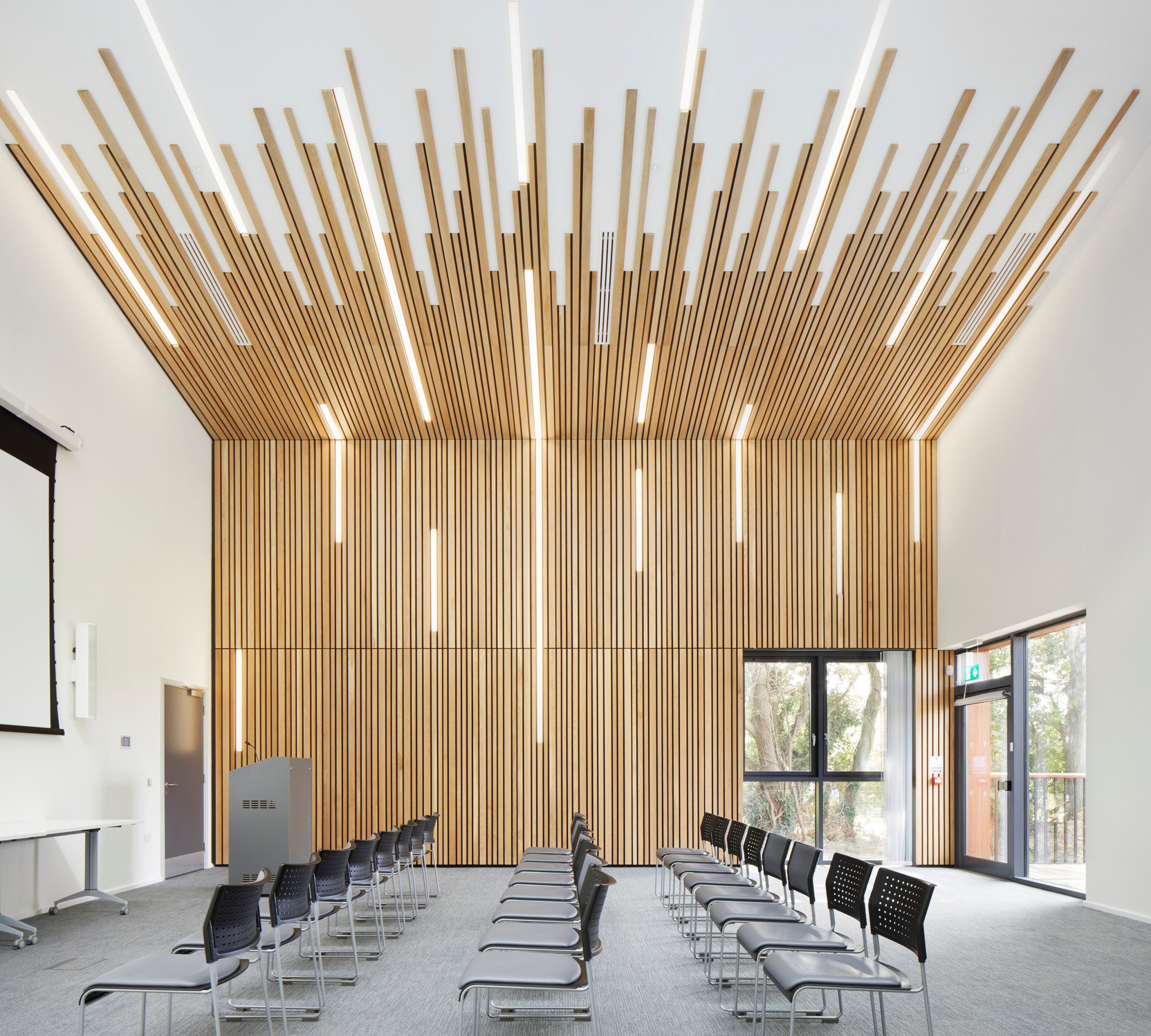 Modern Quarry Conference Room with wooden accents, ideal for workshops and presentations.