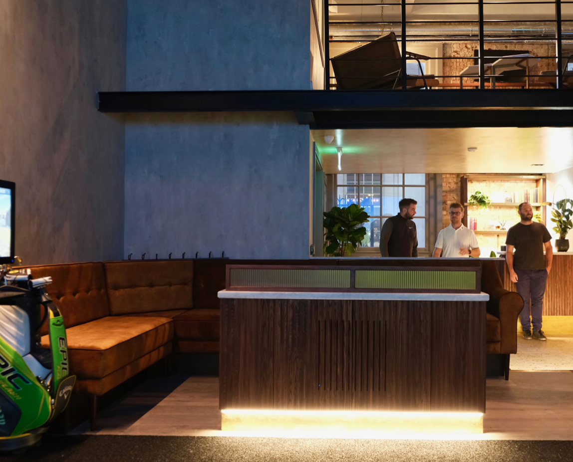 Modern event venue with natural light, ideal for meetings and networking.