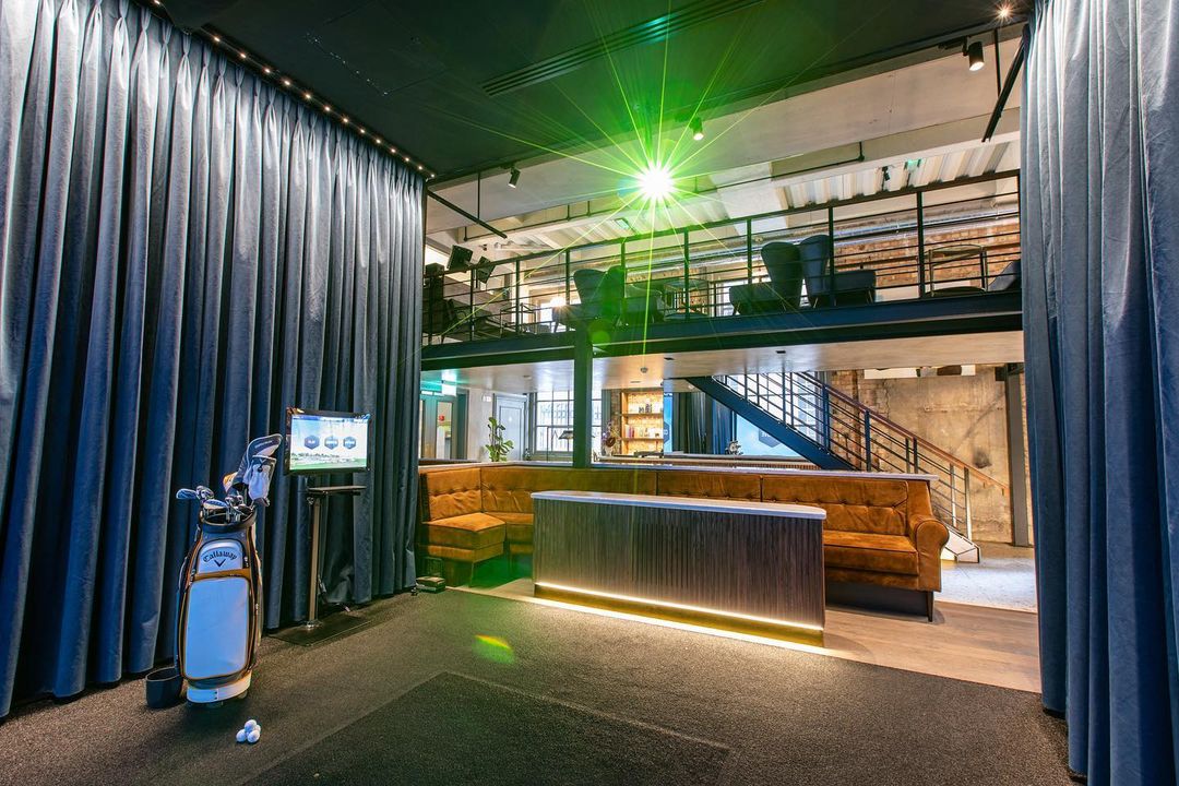 Modern multi-level event space with plush seating for corporate events and social functions.