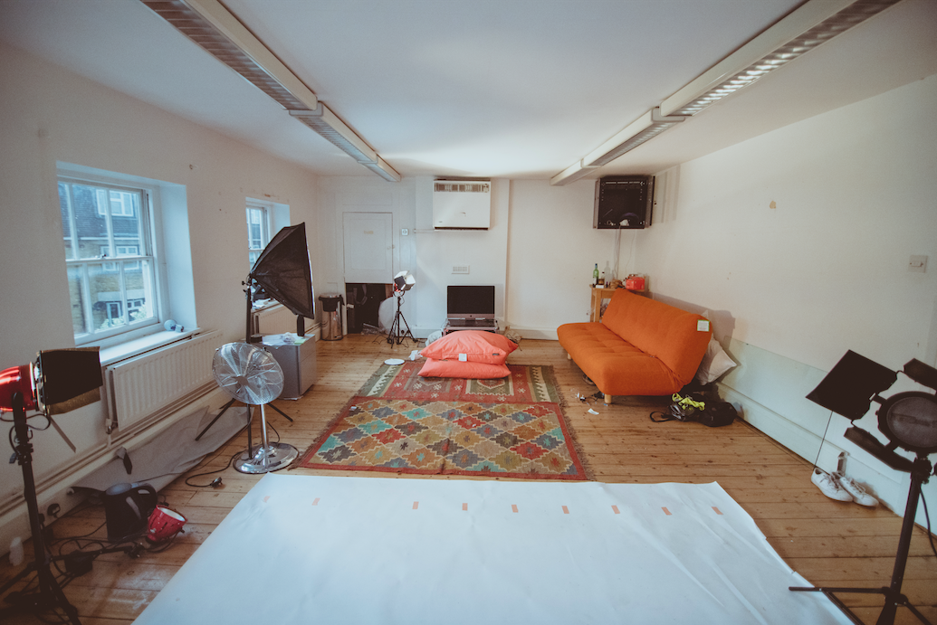 Bright studio space with seating for creative meetings and events, perfect for collaboration.