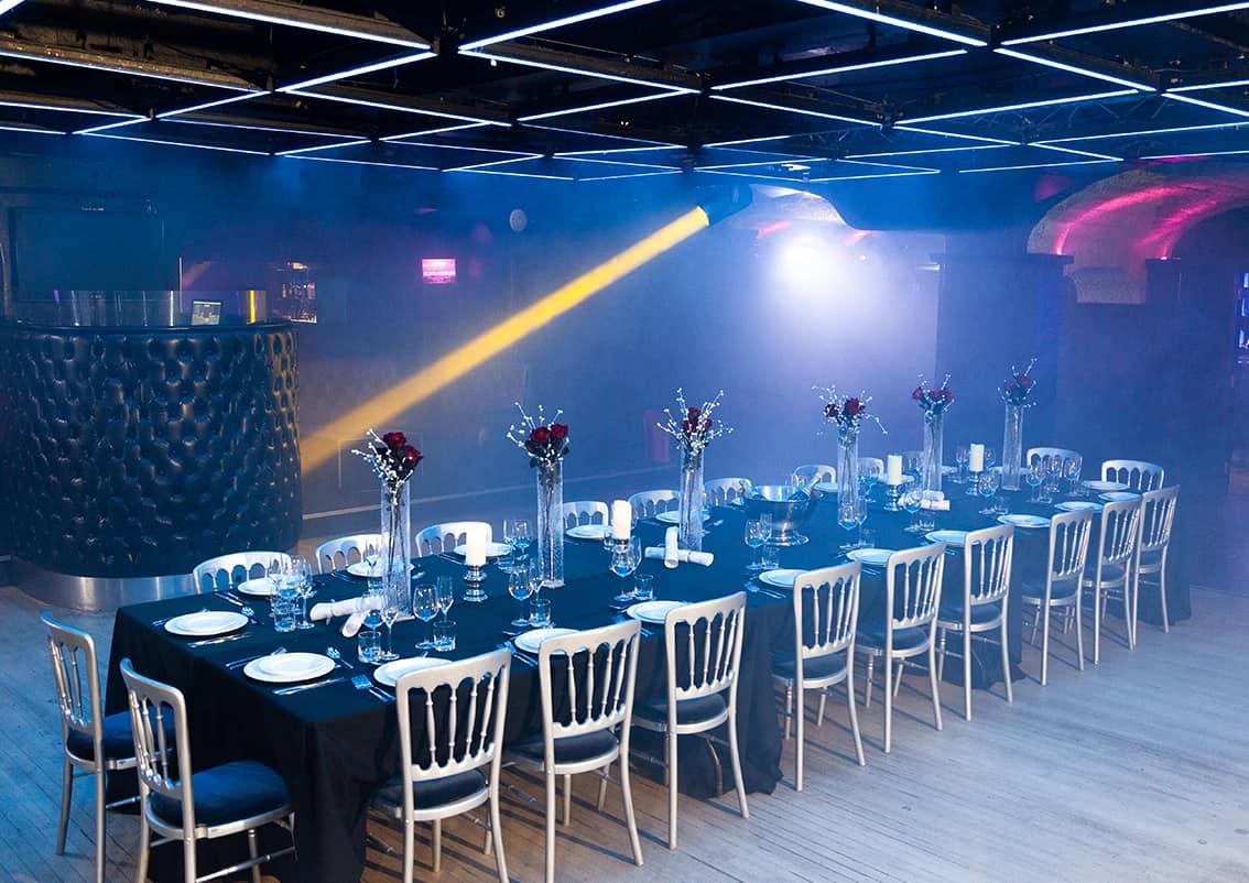 Elegant dinner setup at Why Not Nightclub for corporate events and upscale gatherings.