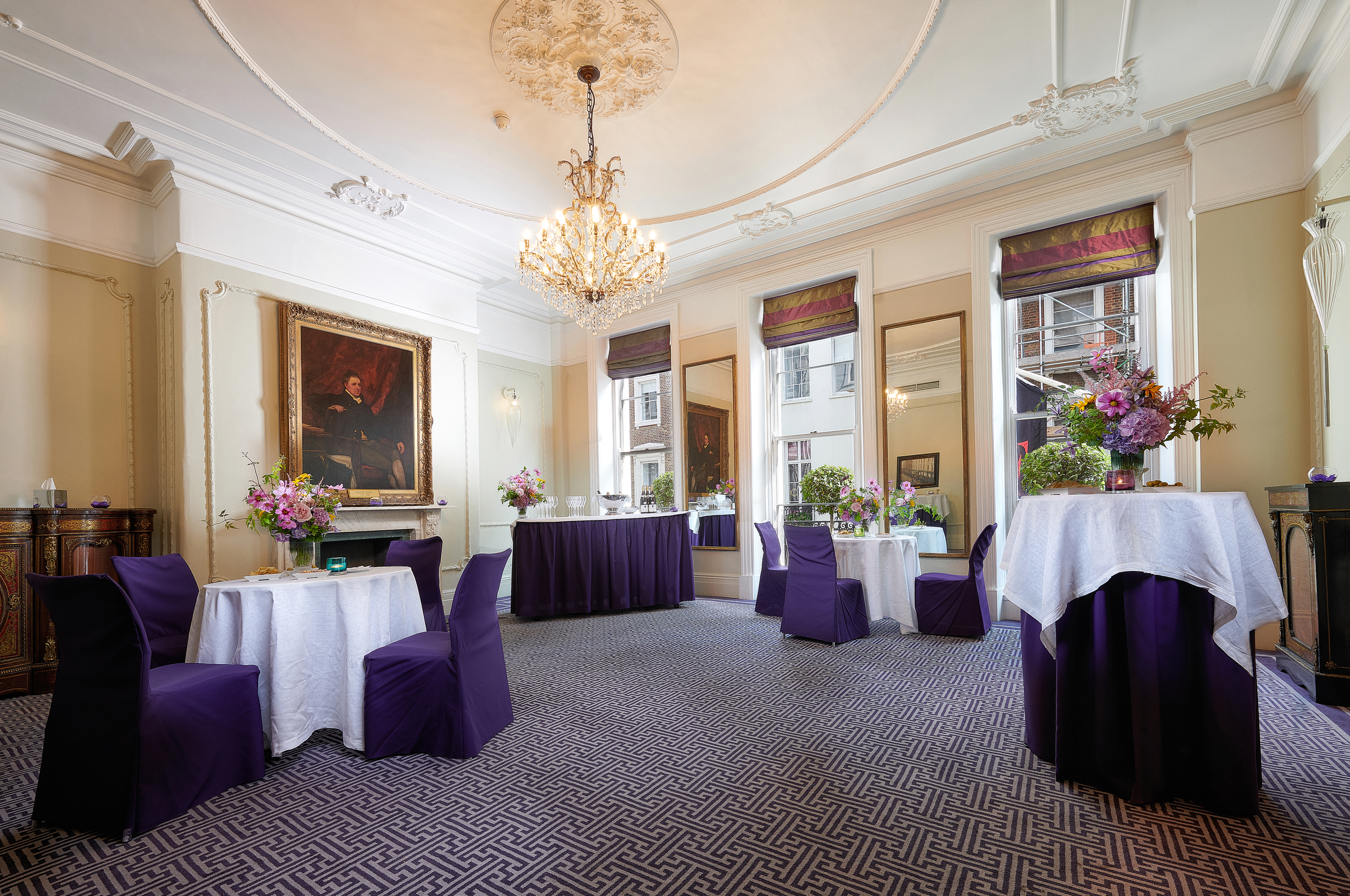 Elegant event space in Brown's Hotel with purple accents, ideal for corporate meetings.