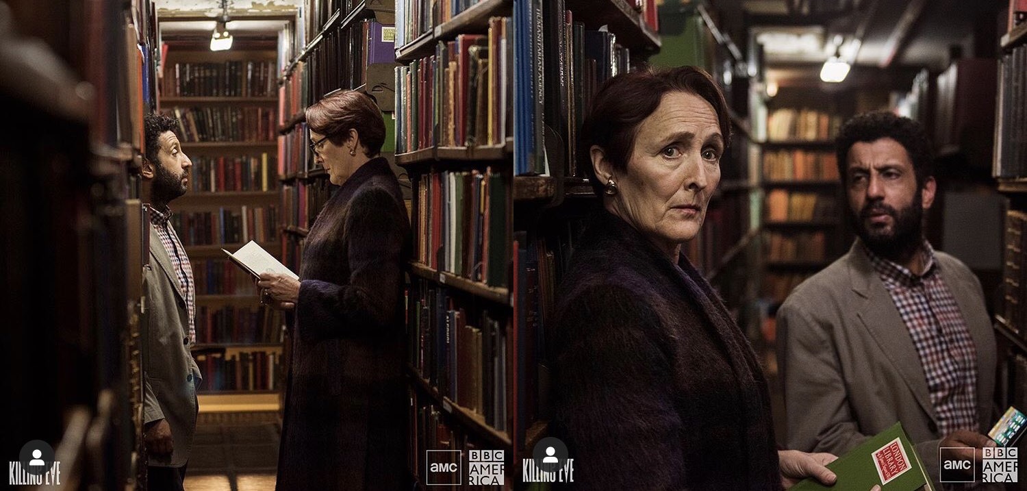 Tense meeting in The London Library, dim lighting, ideal for negotiations and discussions.