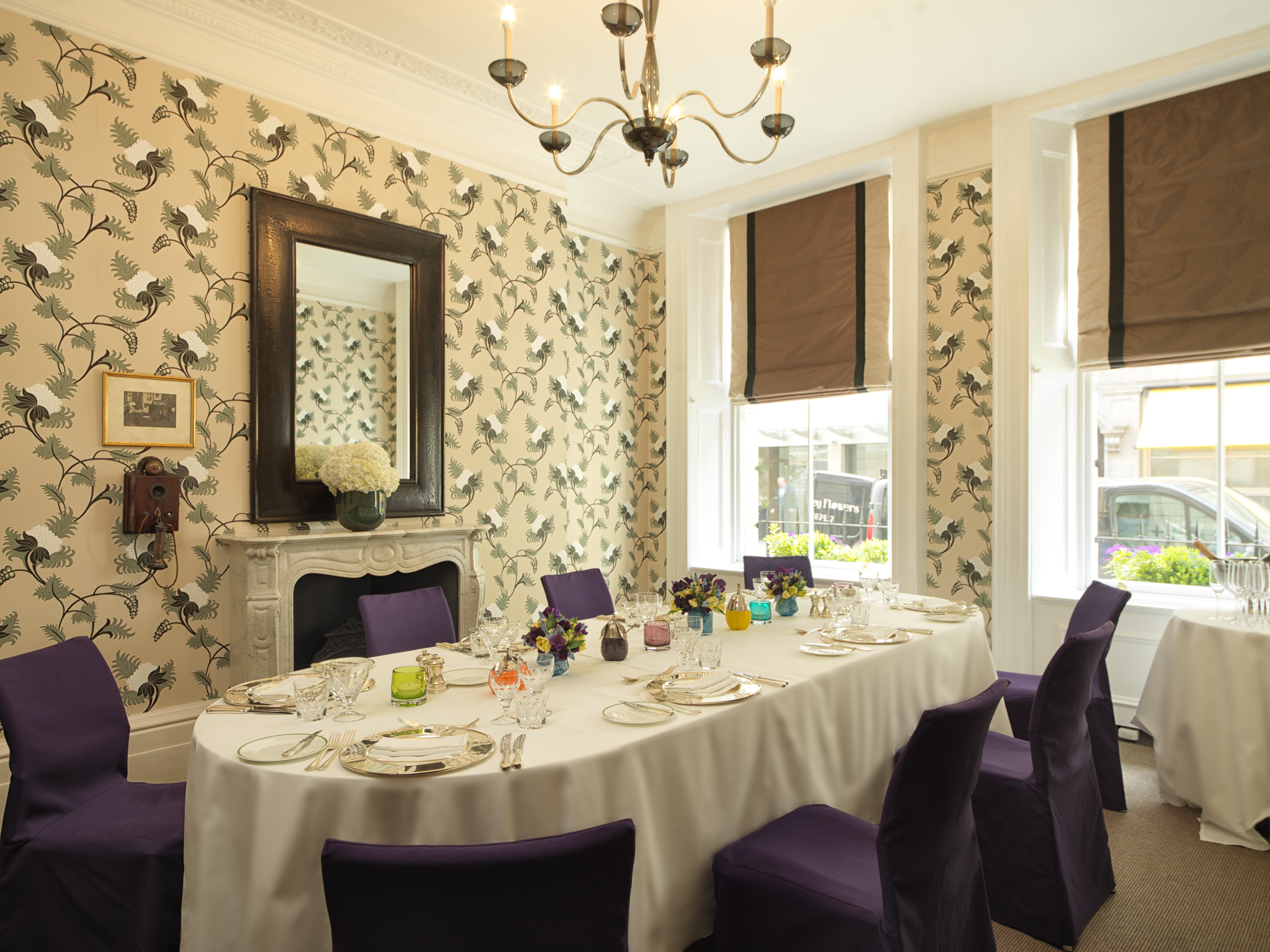 Graham Bell in a stylish meeting room with round table, ideal for corporate events.