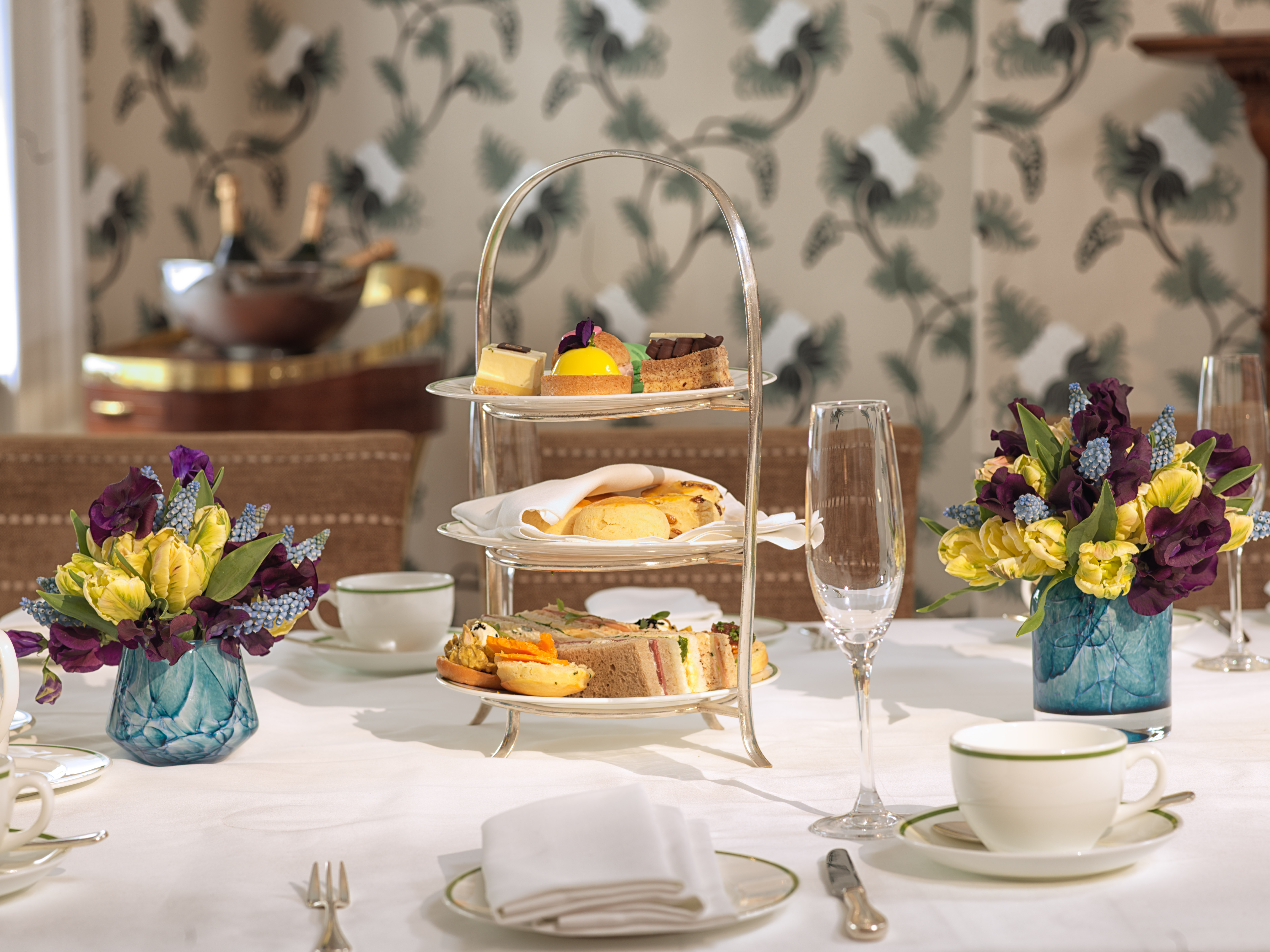 Graham Bell at Brown's Hotel, elegant afternoon tea with pastries and fine china.