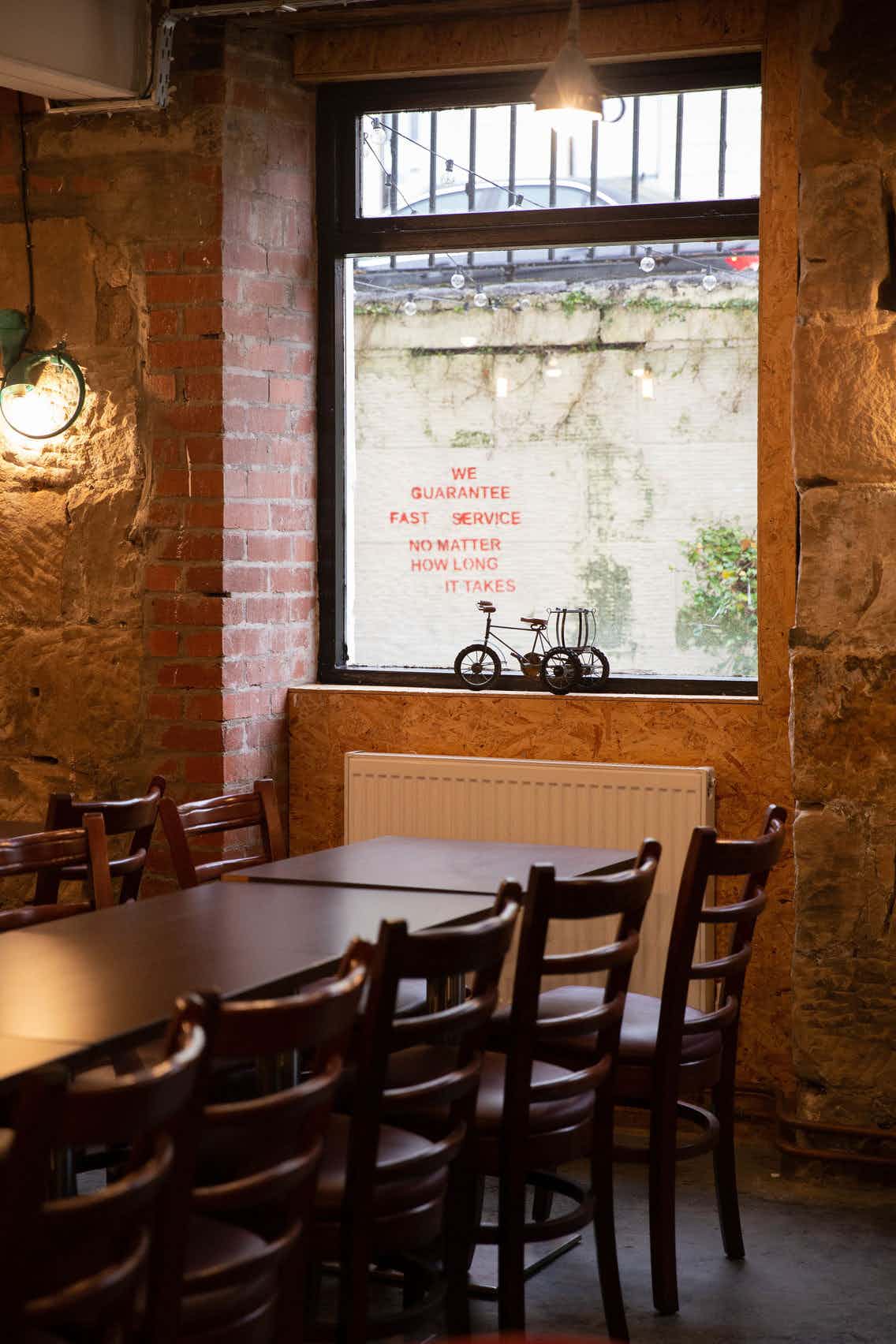 Cozy rustic meeting space with wooden tables for informal gatherings and brainstorming.