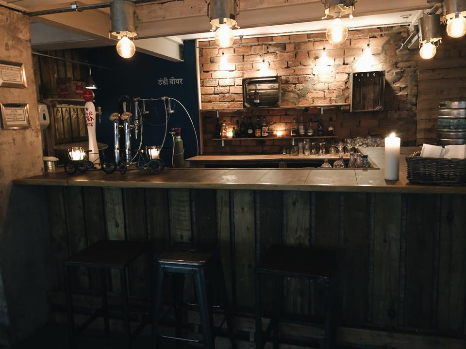 Cozy bar venue with rustic decor for intimate gatherings and networking events.