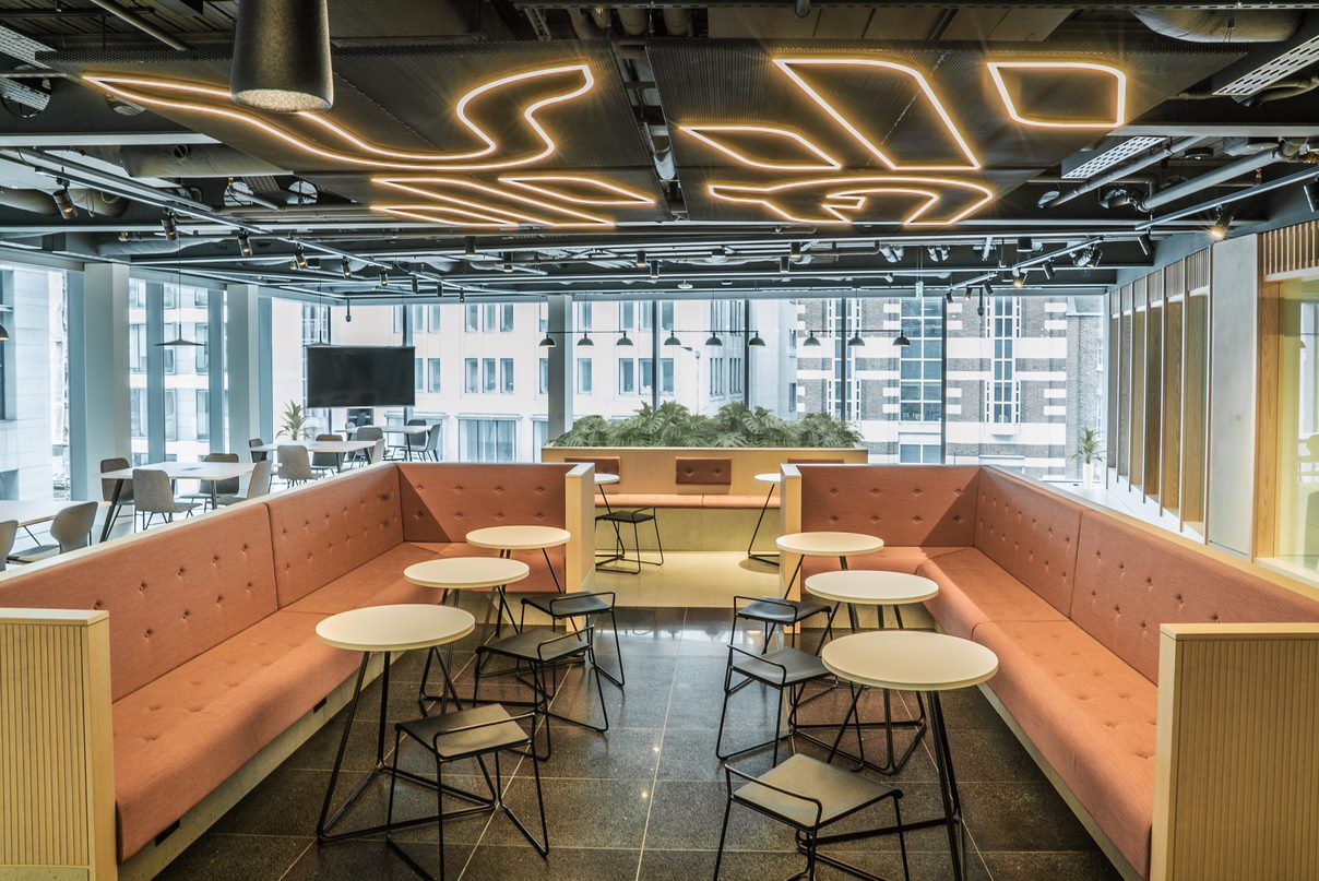 Modern business lounge with flexible seating for meetings and networking events.