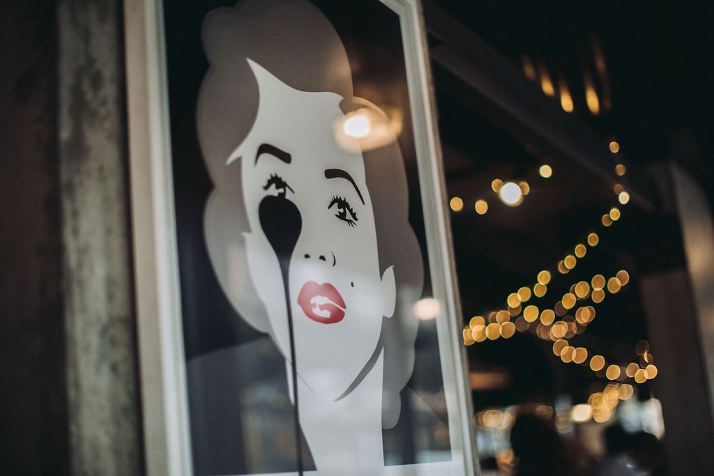 Stylized portrait art in vibrant Heist Bank venue for social events and networking.