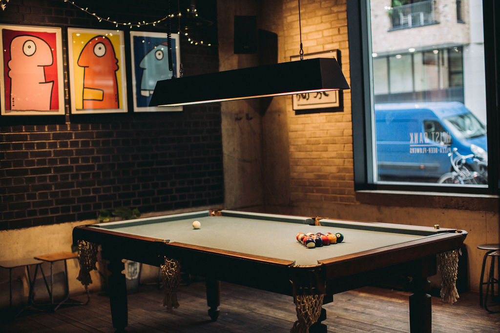 Stylish Heist Bank venue with pool table for team-building and networking events.