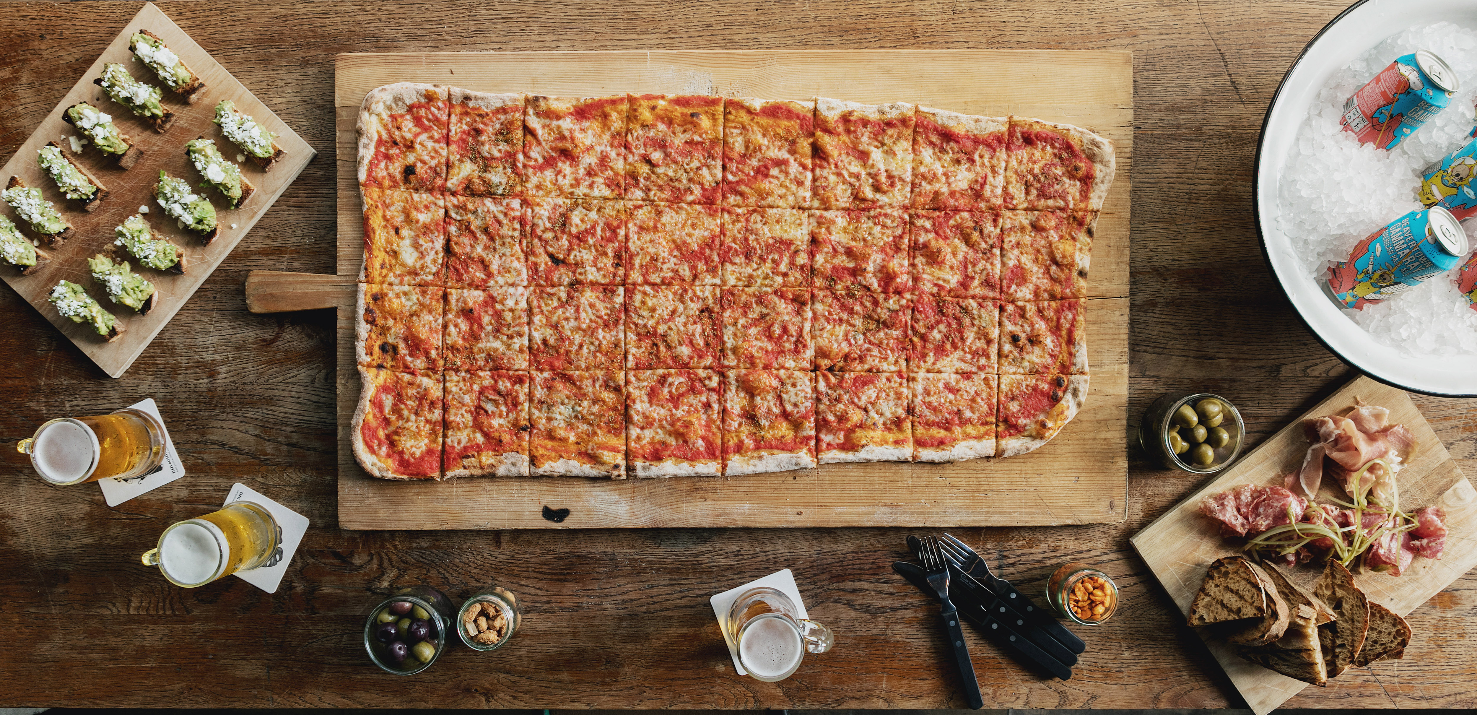 "Whole Venue Heist Bank: Rustic pizza spread for casual gatherings and networking events."