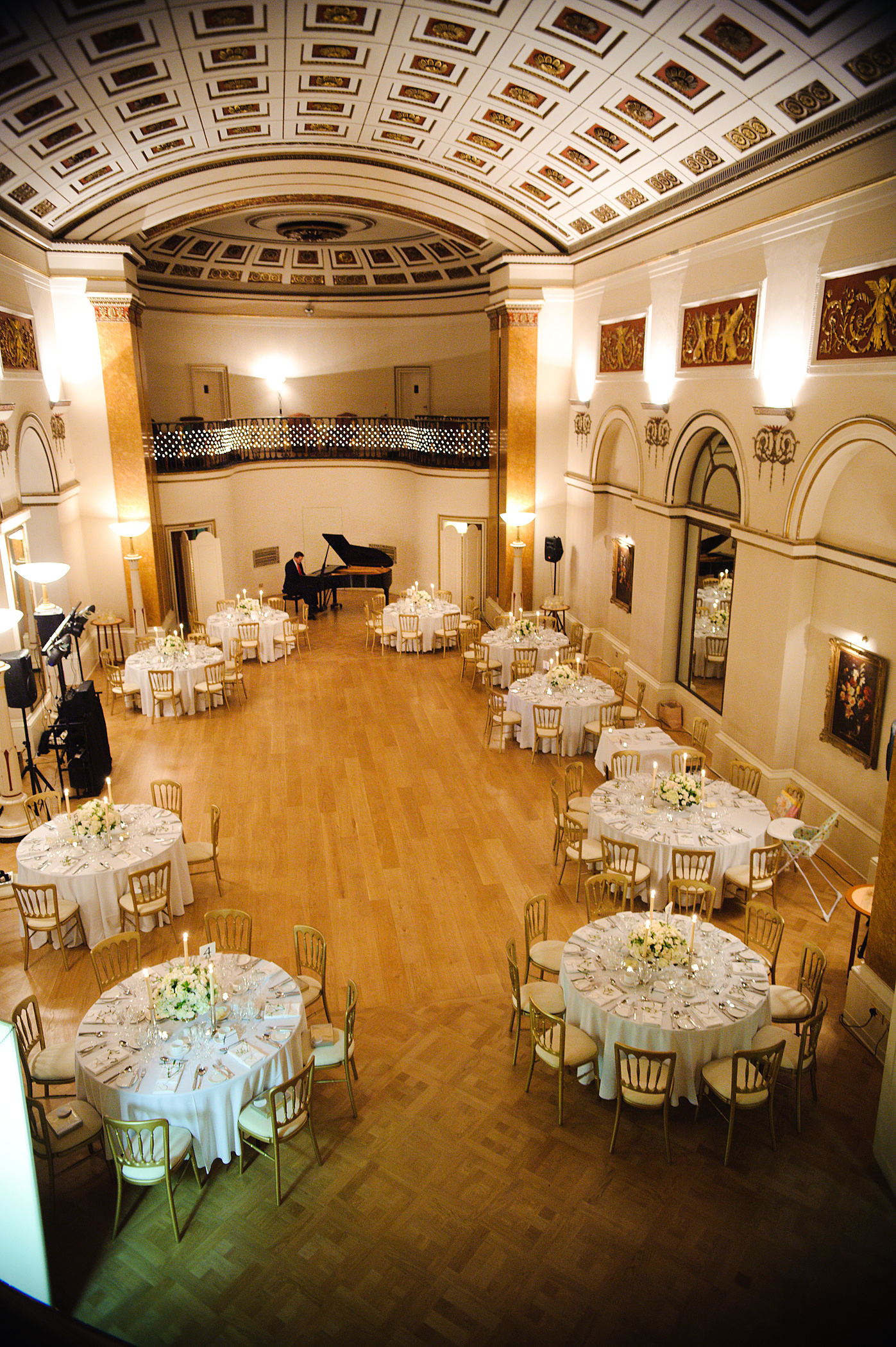 Elegant ballroom with round dining tables, perfect for weddings and gala dinners.