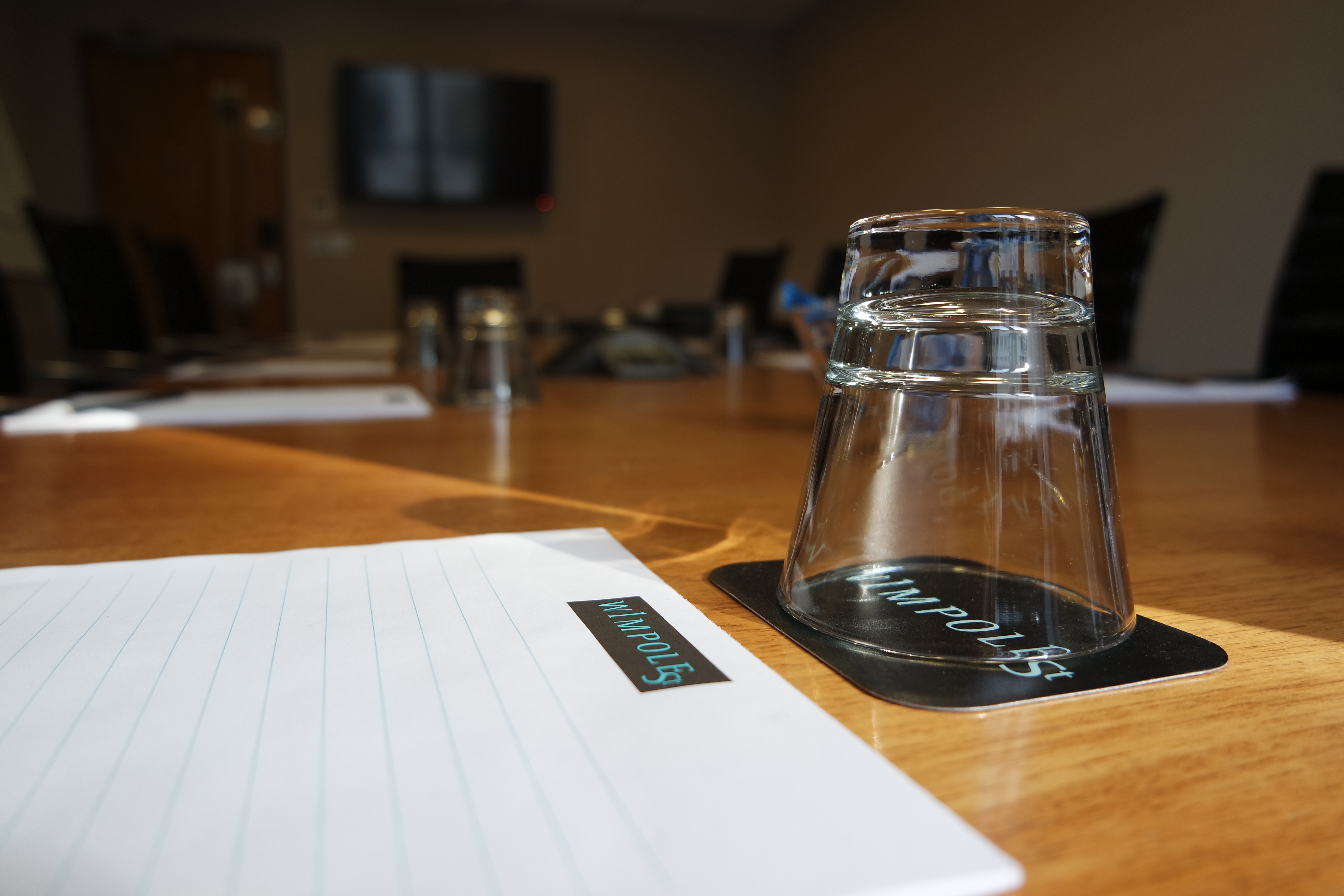 Louis Forman Room meeting space with polished table, ideal for professional events and discussions.