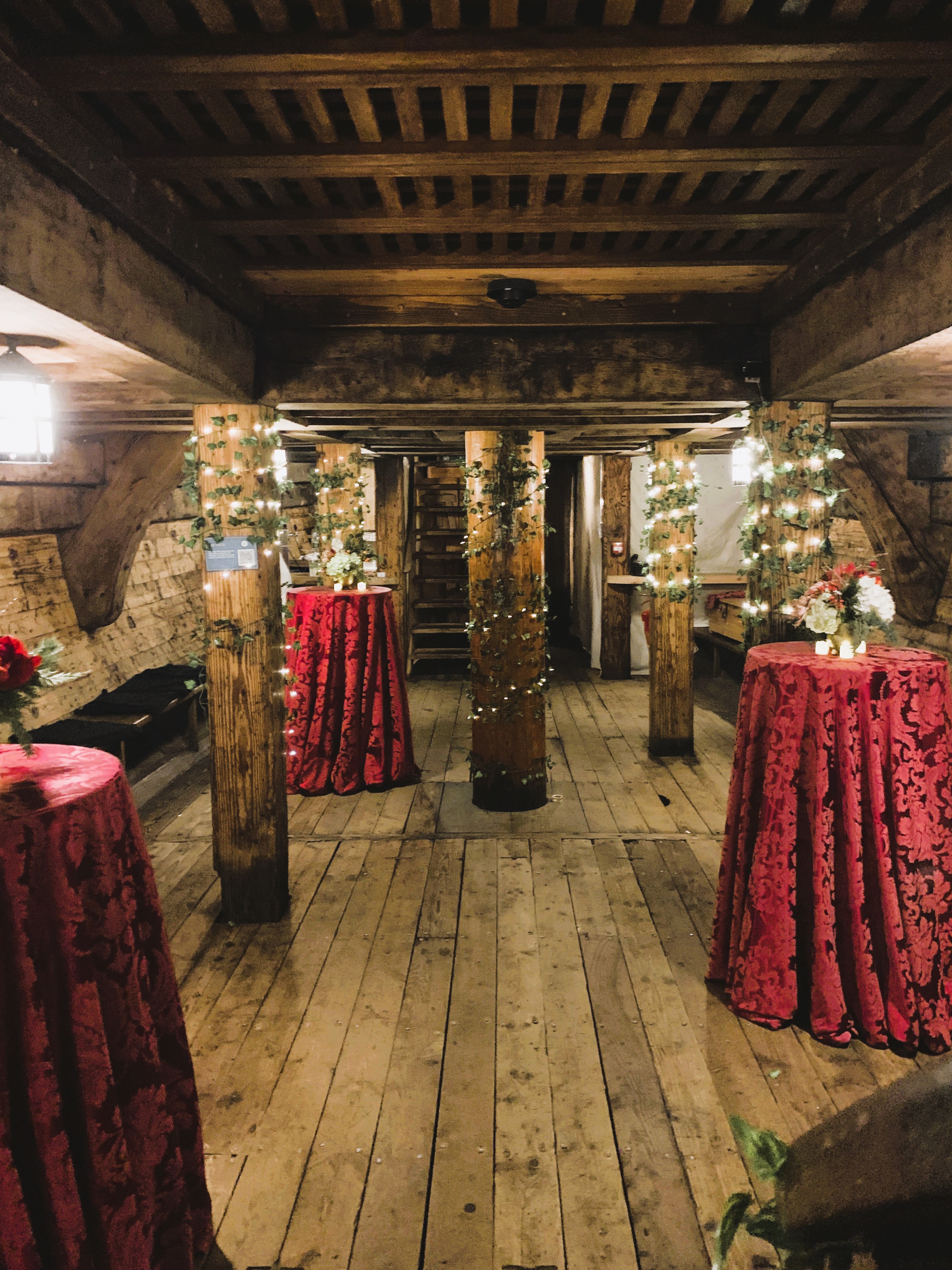 Rustic event space in The Golden Hinde with wooden beams, perfect for intimate celebrations.