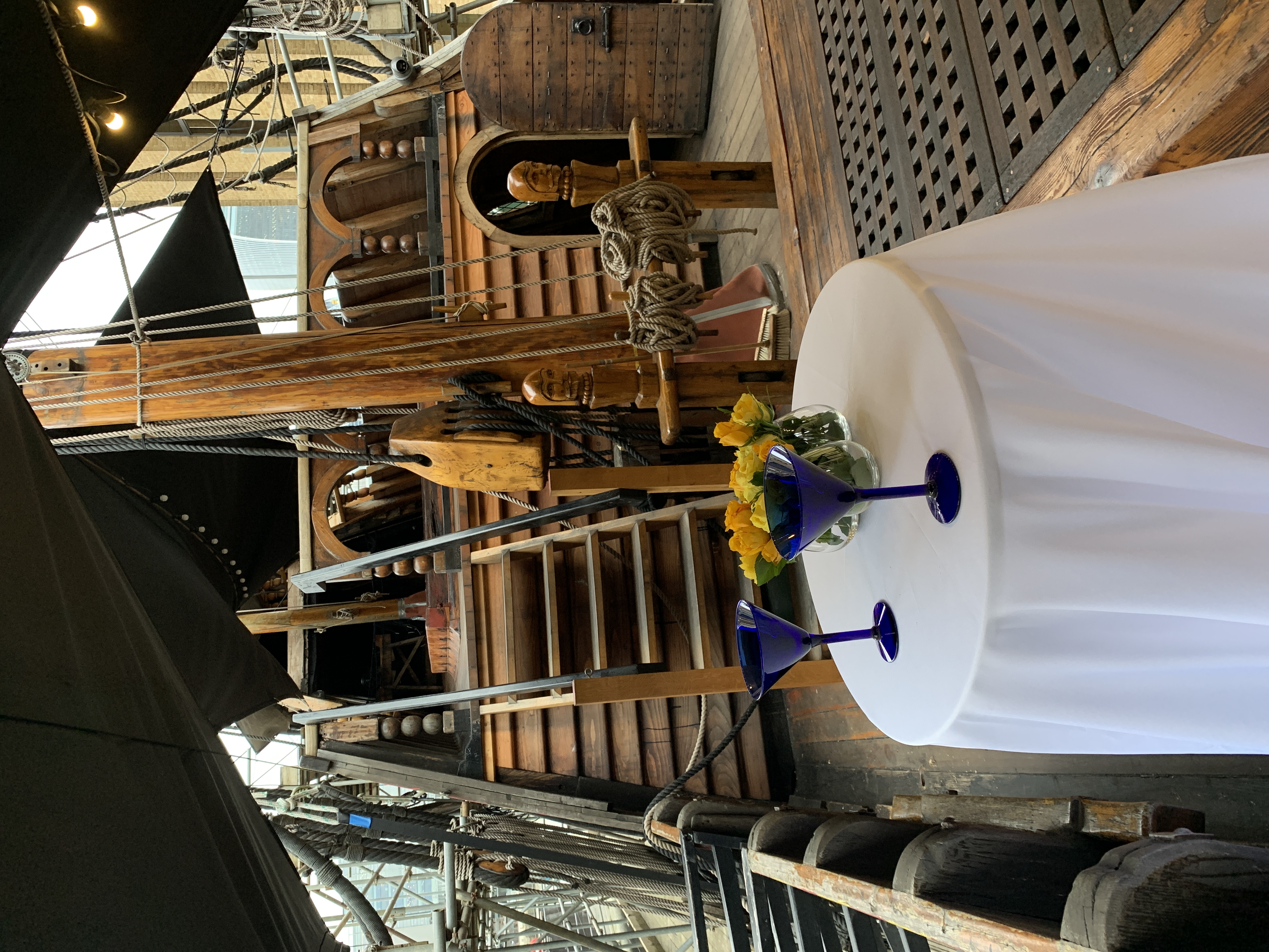 Whole Venue on The Golden Hinde: rustic ship event space with floral decor for gatherings.