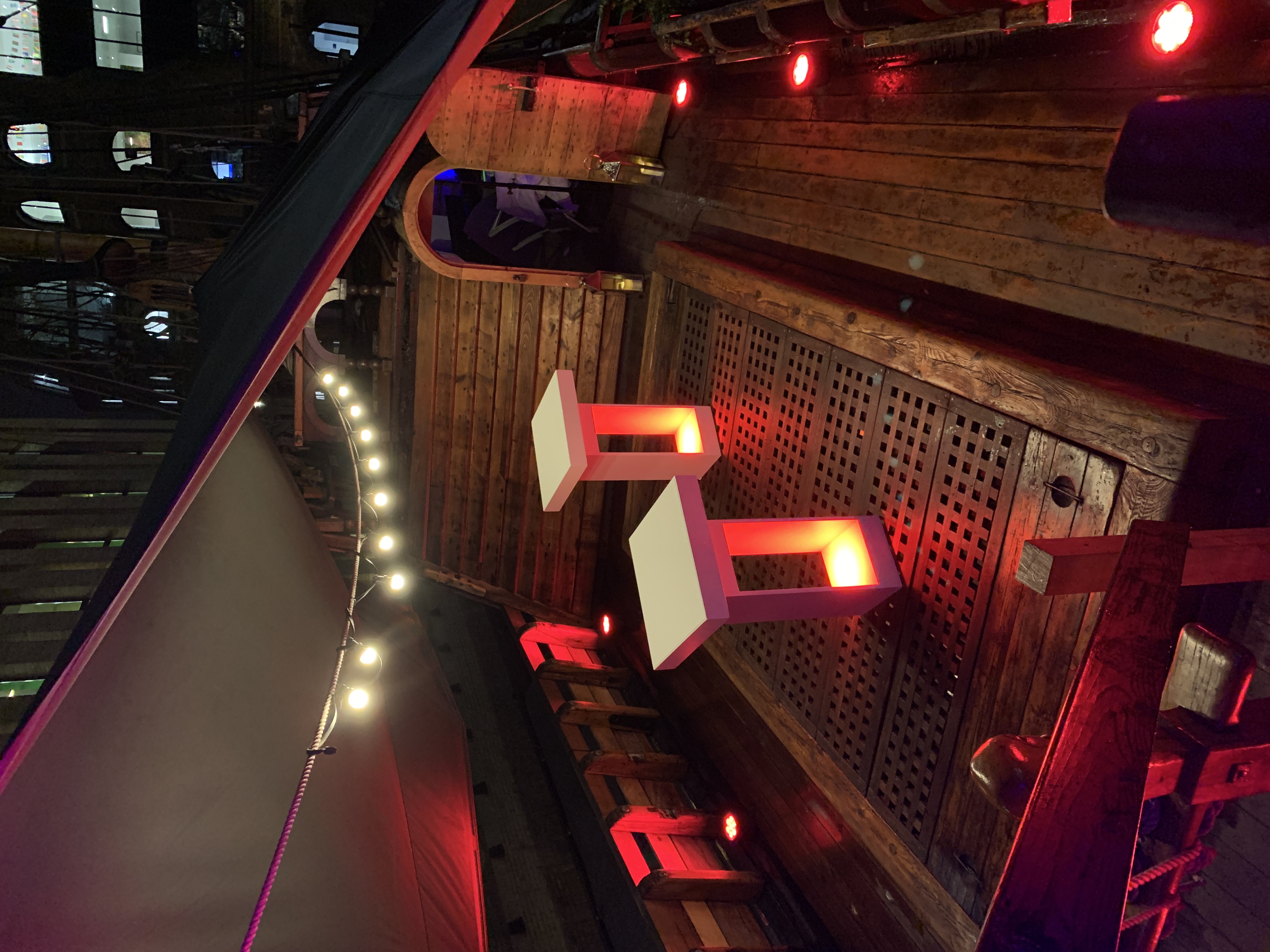 Whole Venue on The Golden Hinde with illuminated podiums for events and presentations.