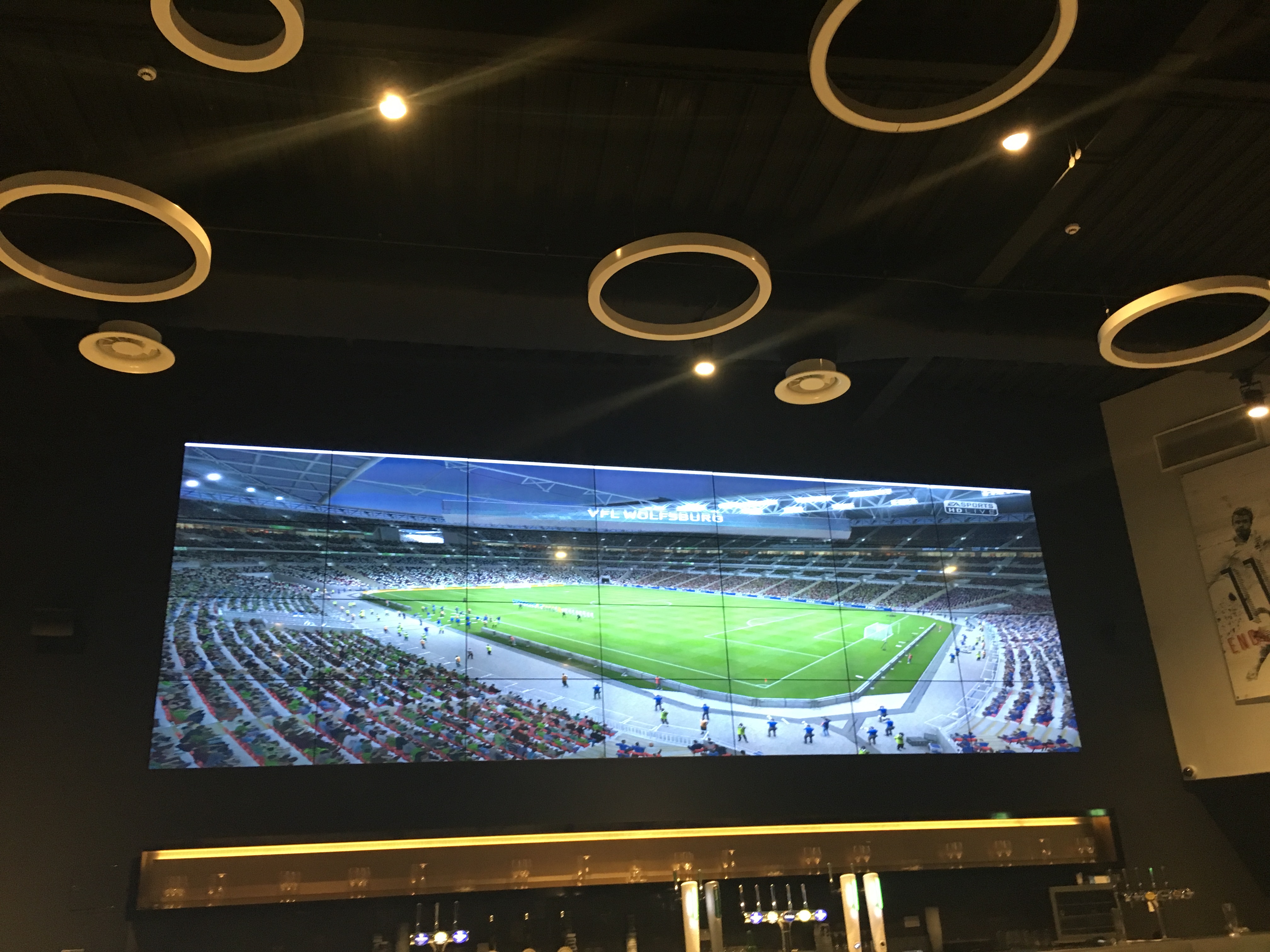 Ashton Gate Stadium sports bar with large display for corporate events and gatherings.