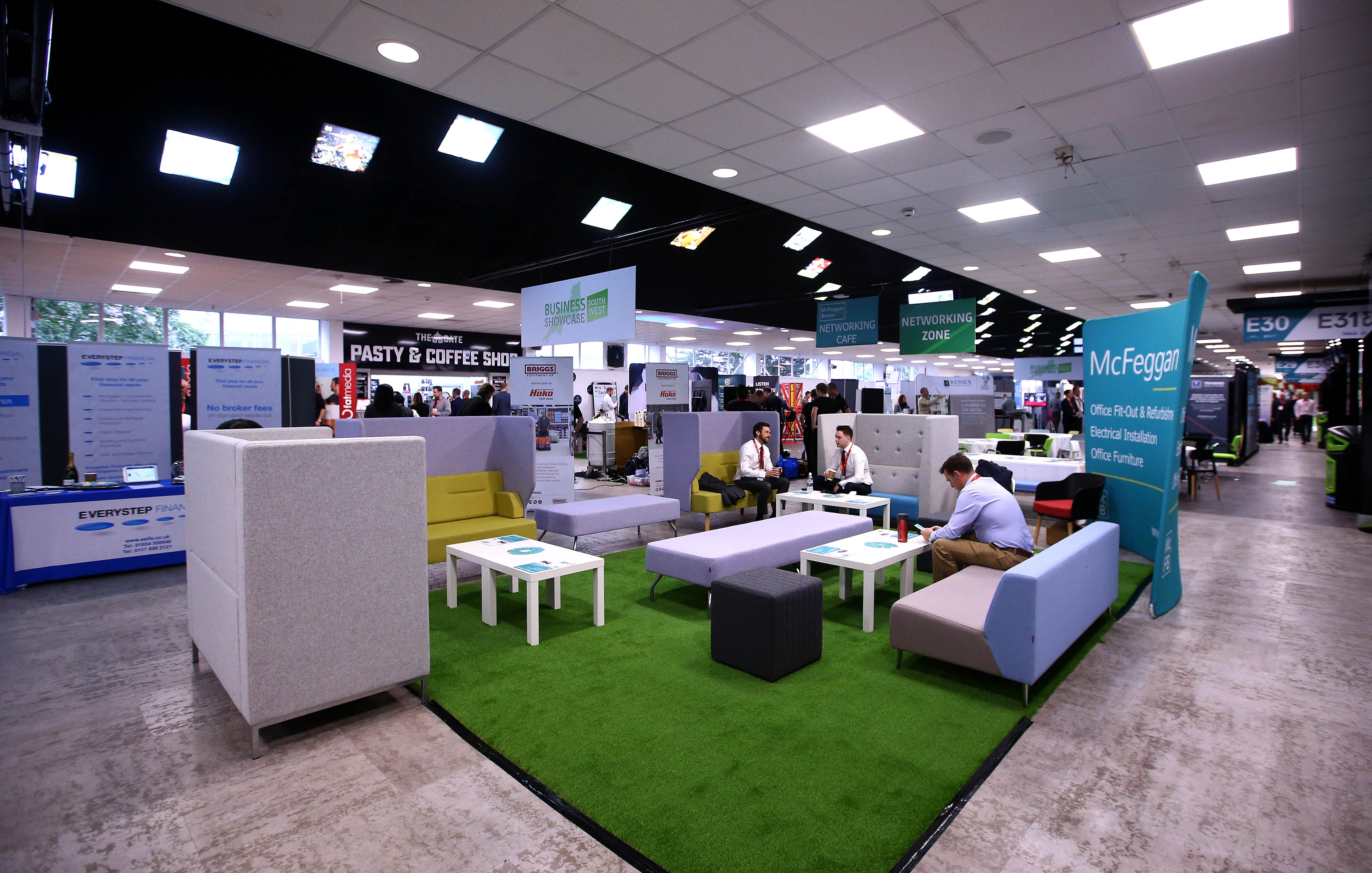 Dolman Hall at Ashton Gate Stadium: modern exhibition space with lounge seating for networking.