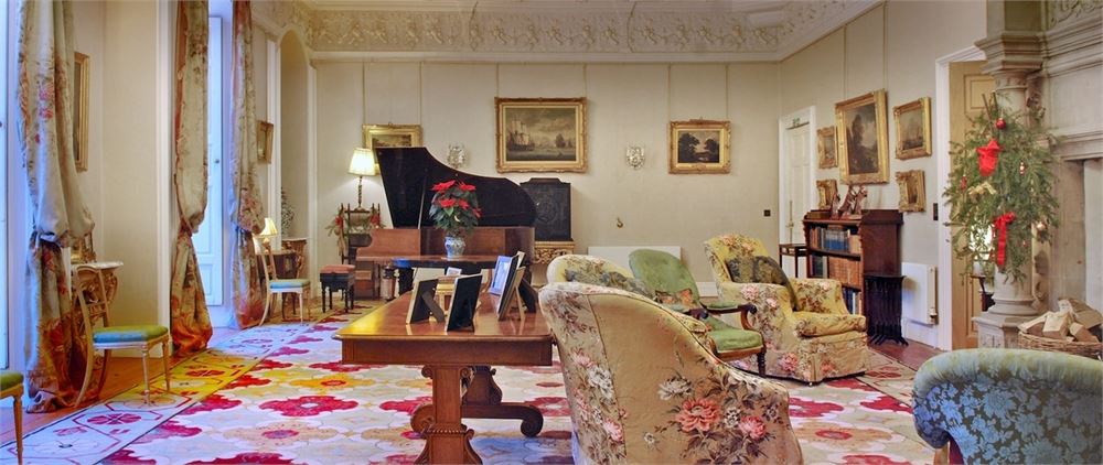 Elegant meeting space at Winton Castle with grand piano, perfect for events and gatherings.