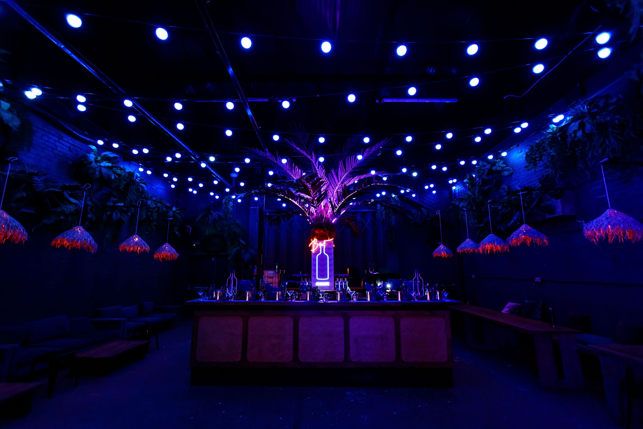 Vibrant Palm Bar at Night Tales, ideal for upscale events and themed parties.