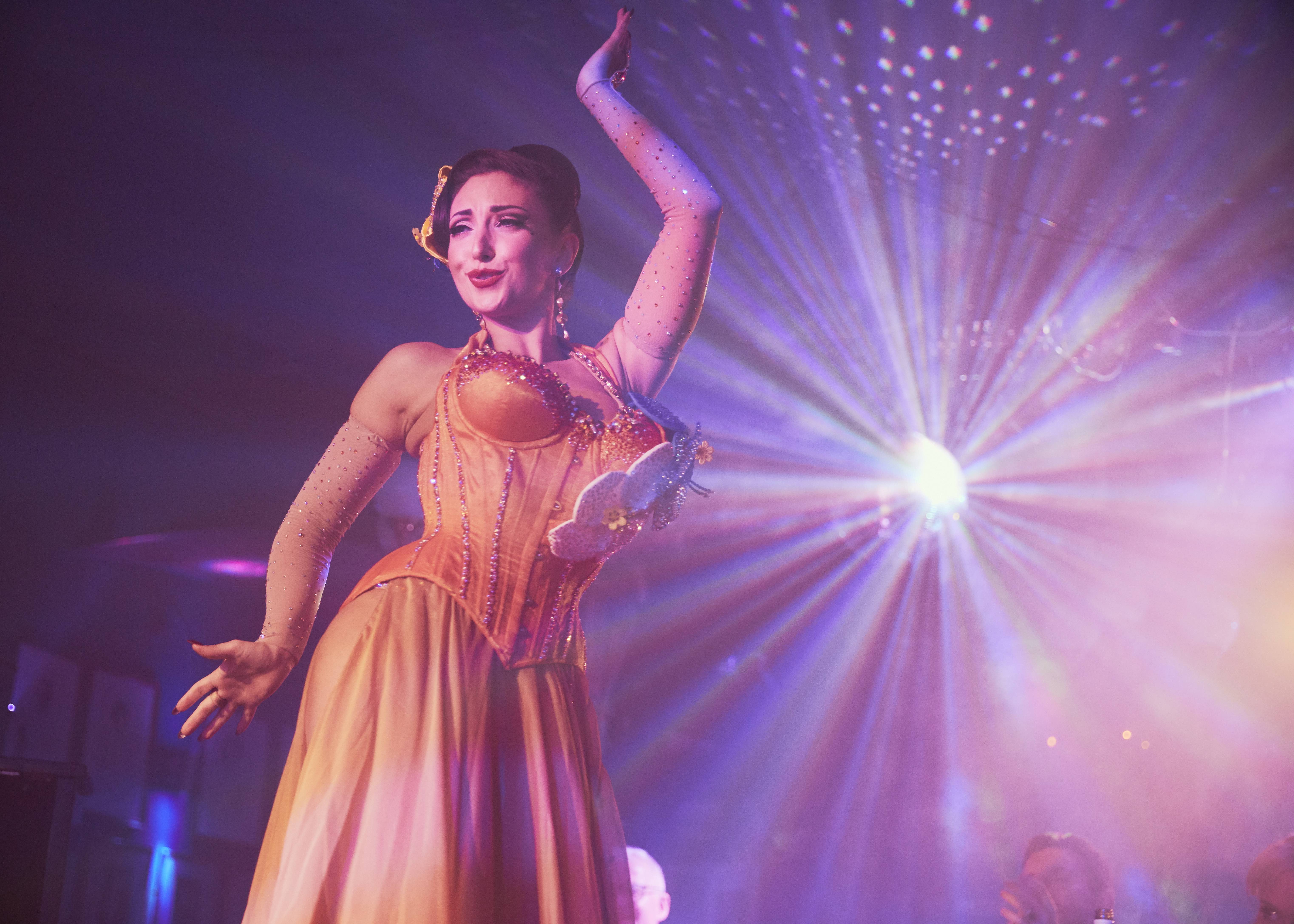 "Captivating performer in elegant costume at Phoenix Arts Club event"