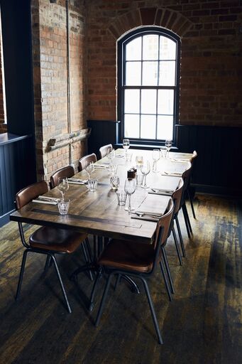 Elegant dining table at The Button Factory, perfect for private events and meetings.