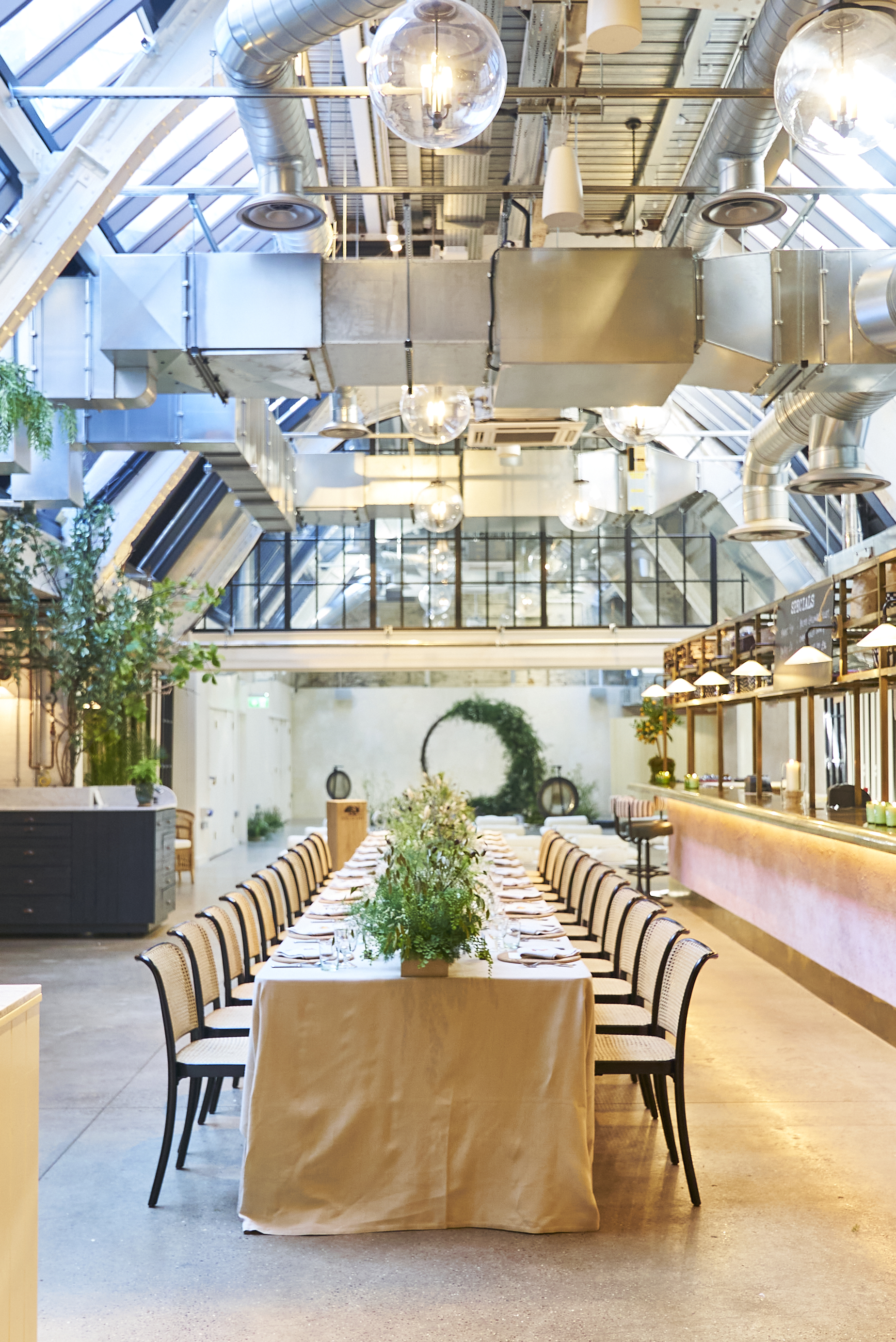 Elegant dining space with greenery for corporate dinners and intimate gatherings.