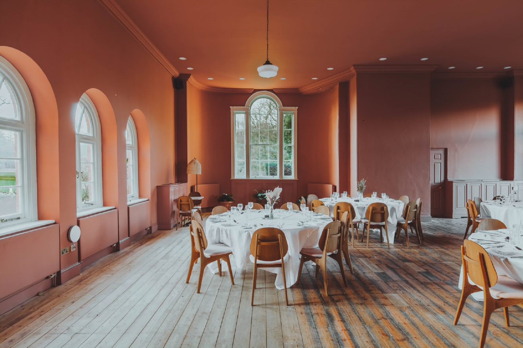 Elegant dining space with floral centerpieces, perfect for events and celebrations.