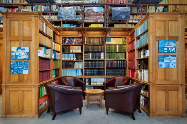 Cozy reading nook with leather chairs in Geological Society library for meetings and events.