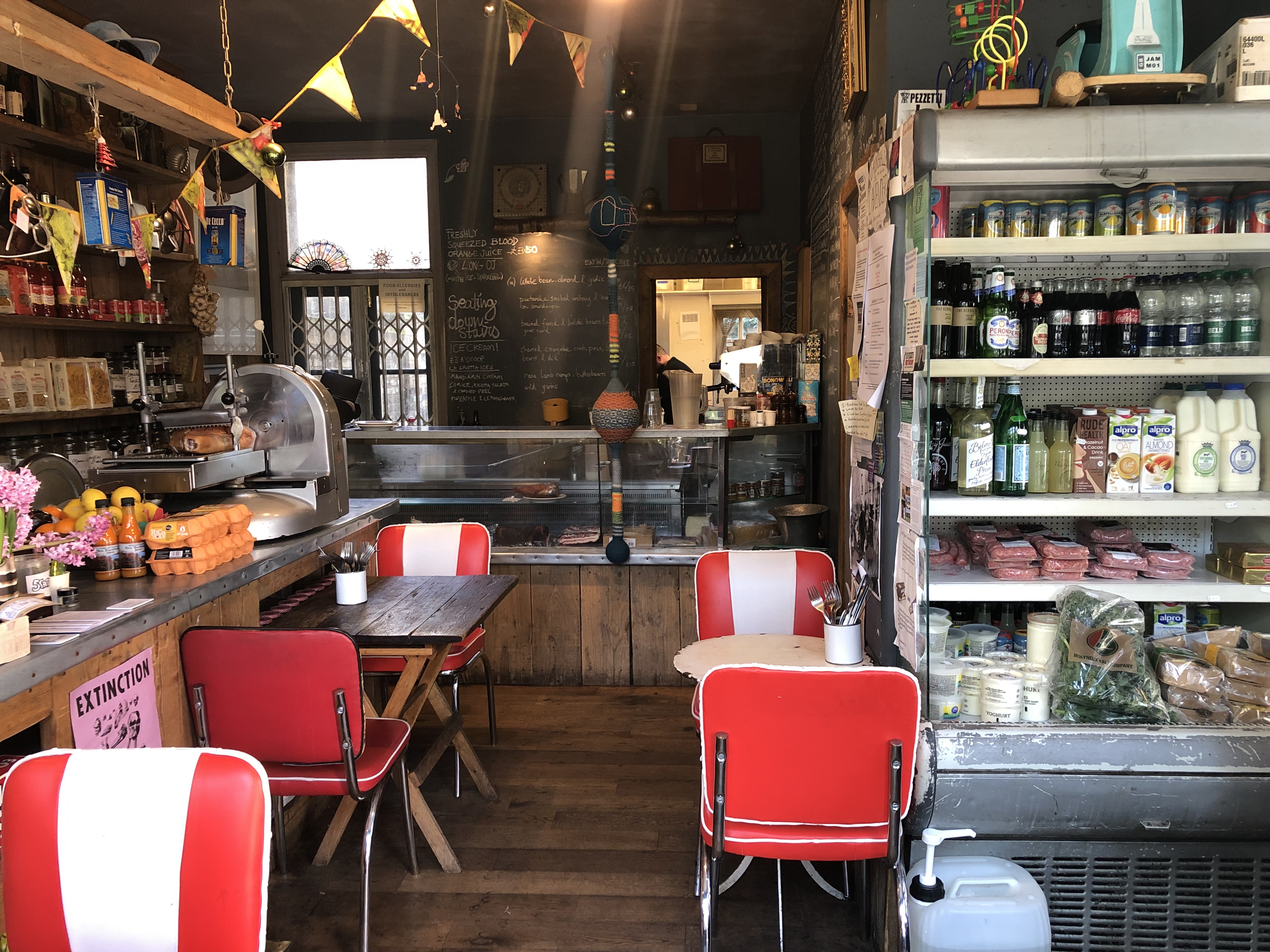 Cozy café venue with rustic decor, perfect for informal meetings and small events.